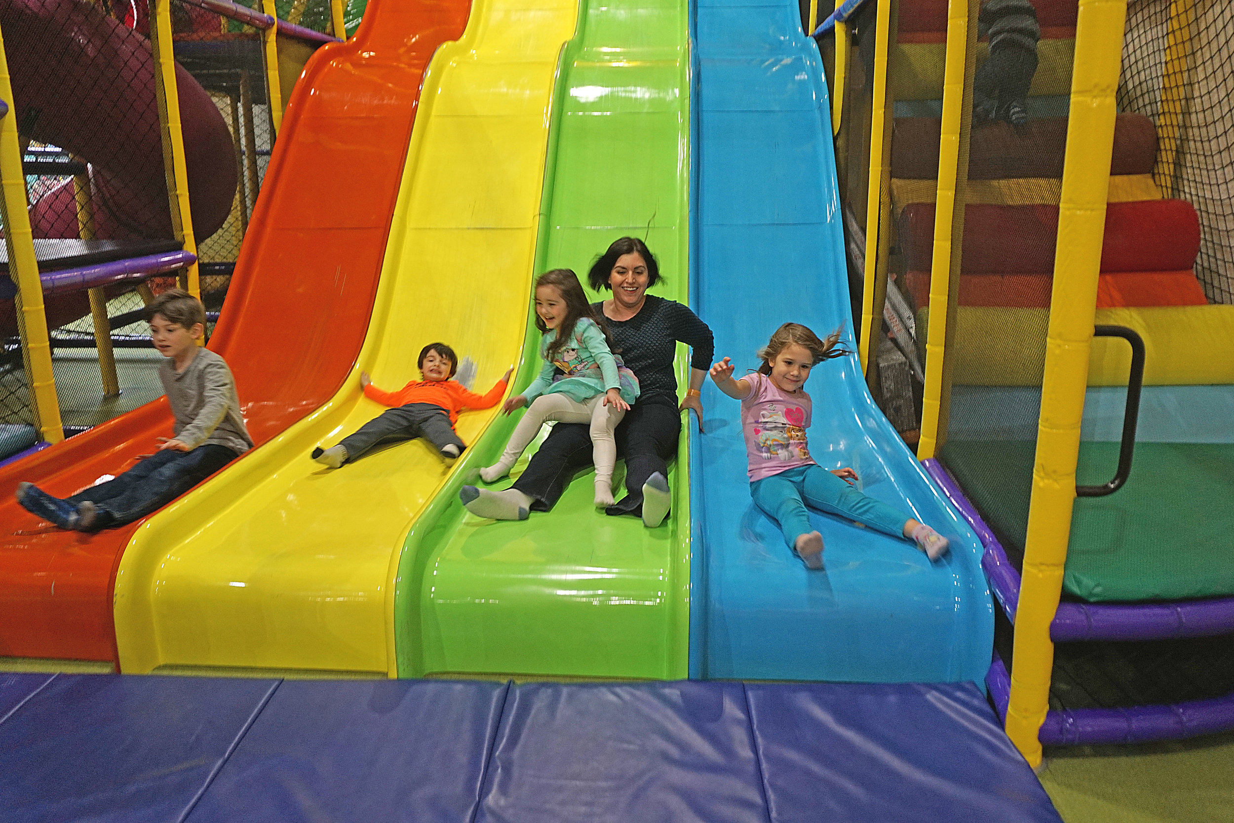 Holding my niece as we go down the big slide!