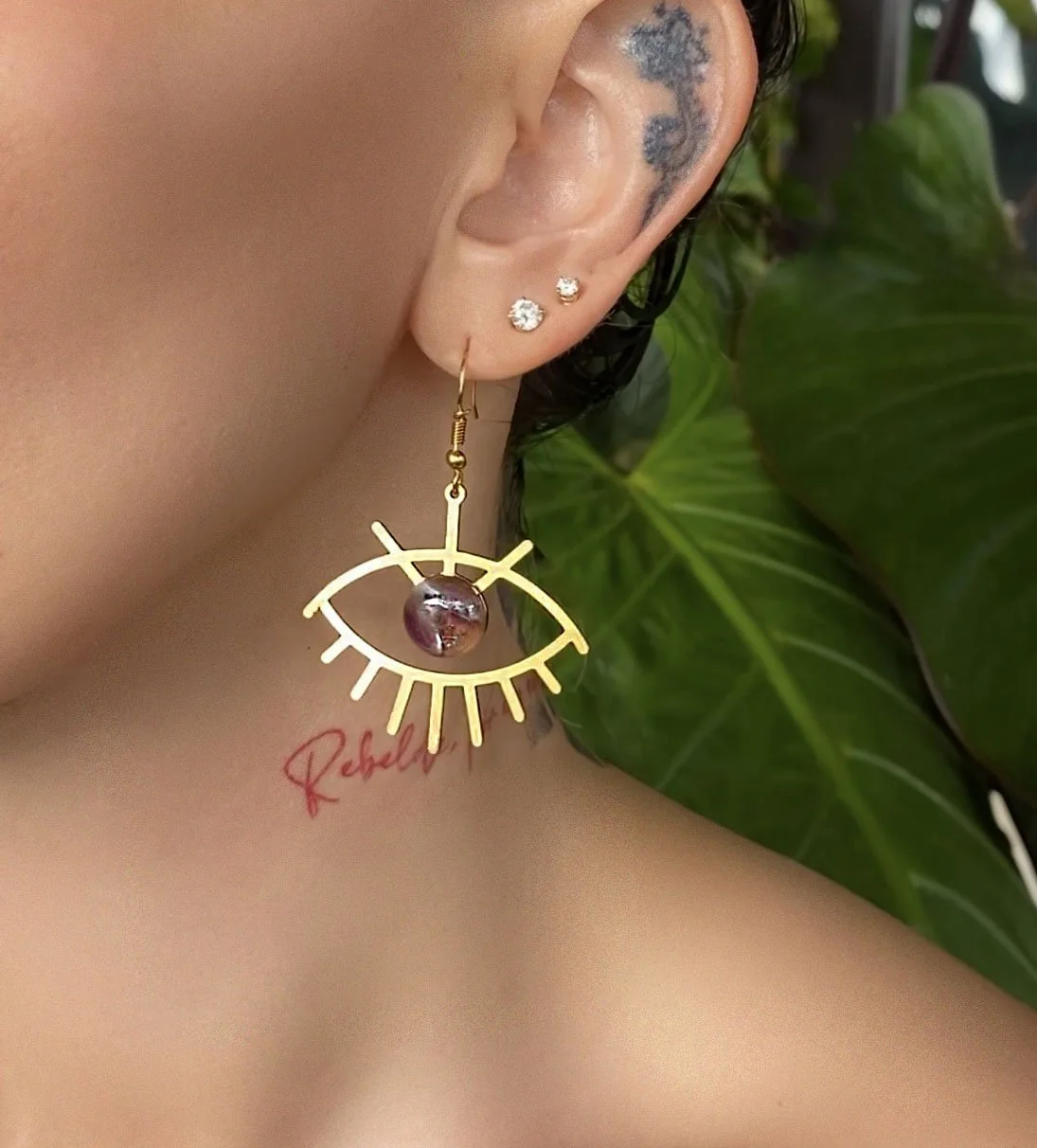 Shop Amethyst Evil Eye Earrings in gold. These amethyst evil eye earrings are a great way to harness your intuition.