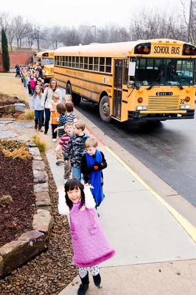 Children leaving buses at WAC.jpg