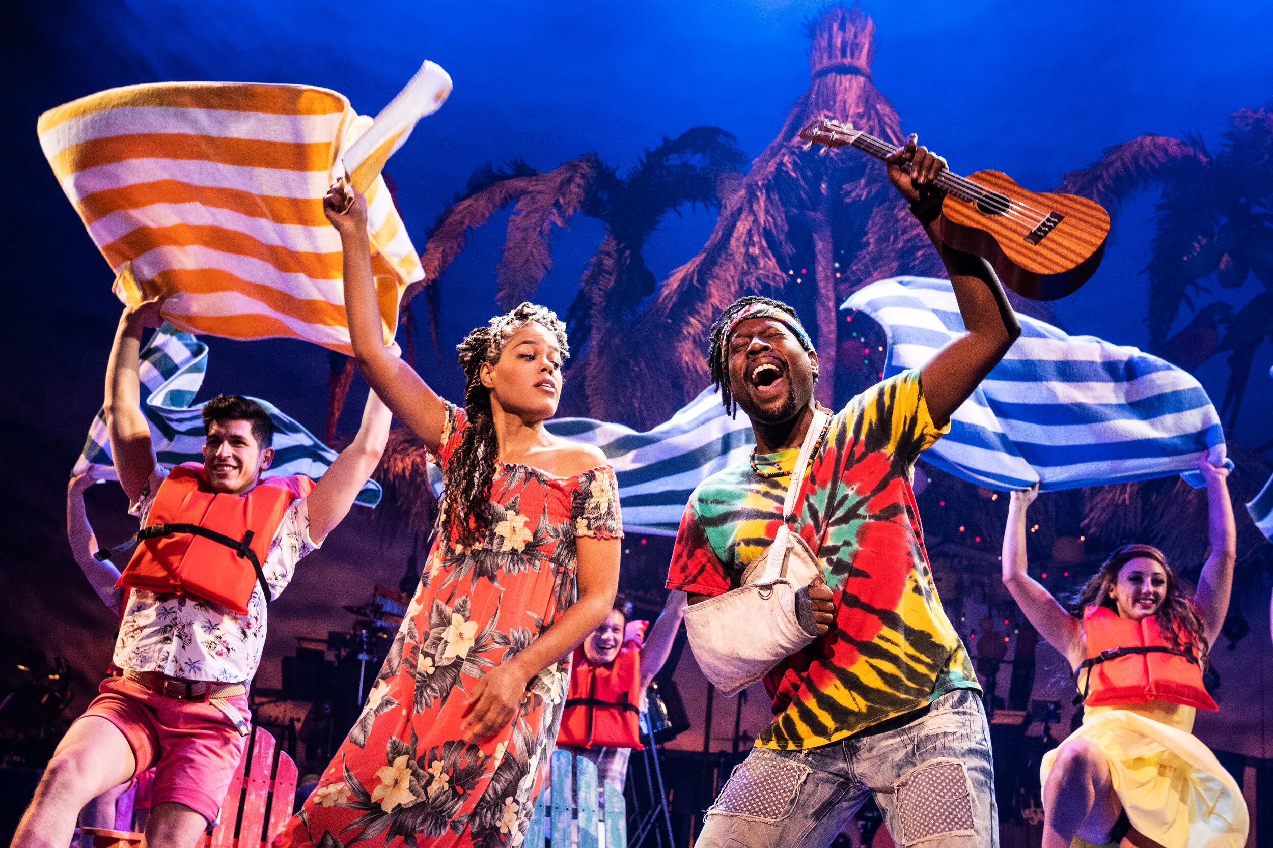 Rachel Lyn Fobbs as Marley, Matthew James Sherrod as Jamaland Companyin Jimmy Buffett’s ESCAPE TO MARGARITAVILLE. © Matthew Murphy