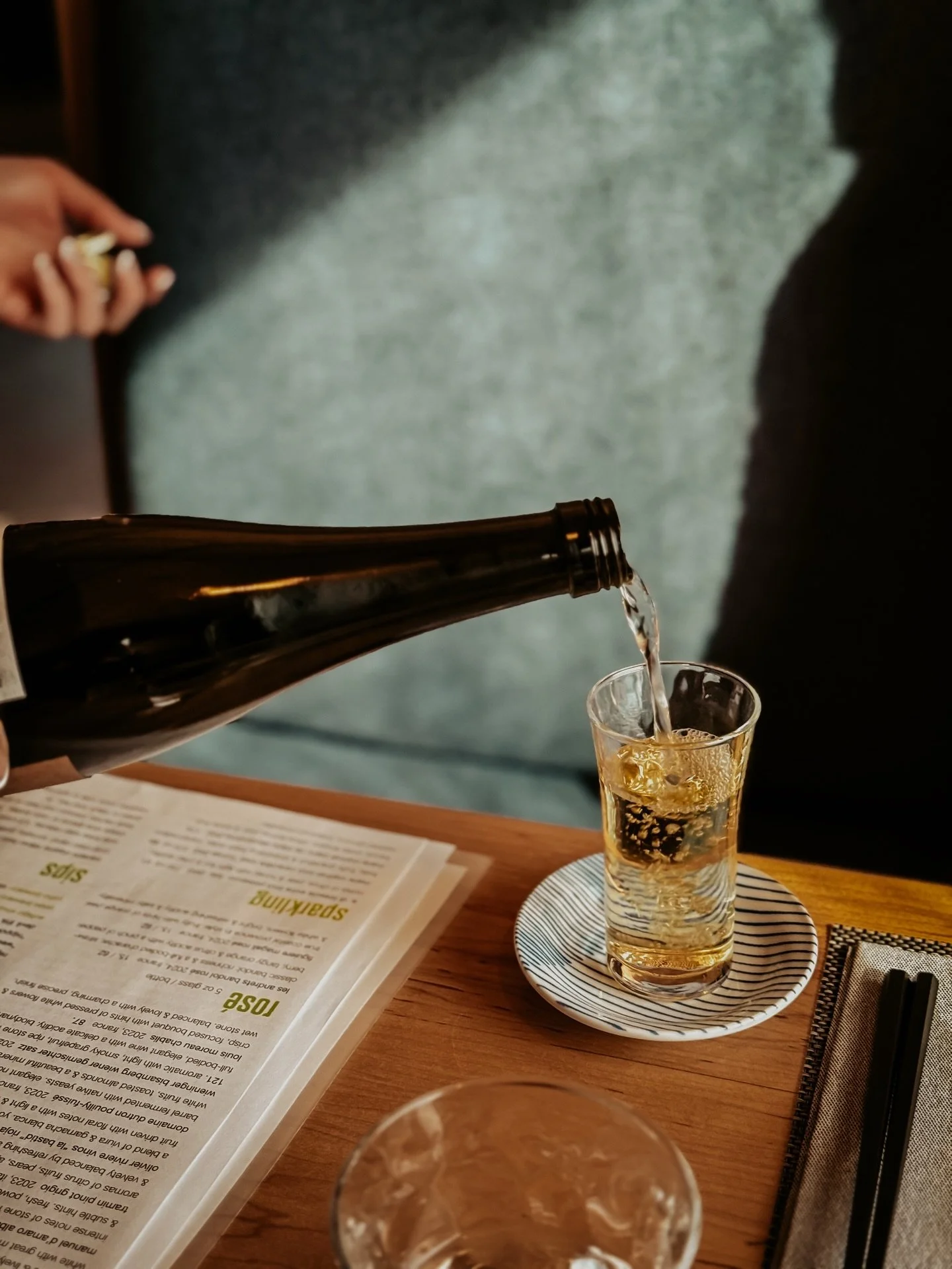 Between Christmas and whatever comes next.

A table set again&mdash;good drinks, beautiful food, familiar faces, and nowhere else to be.

Midday light, plates shared, conversations that stretch longer than planned. No rush back to the world, just one