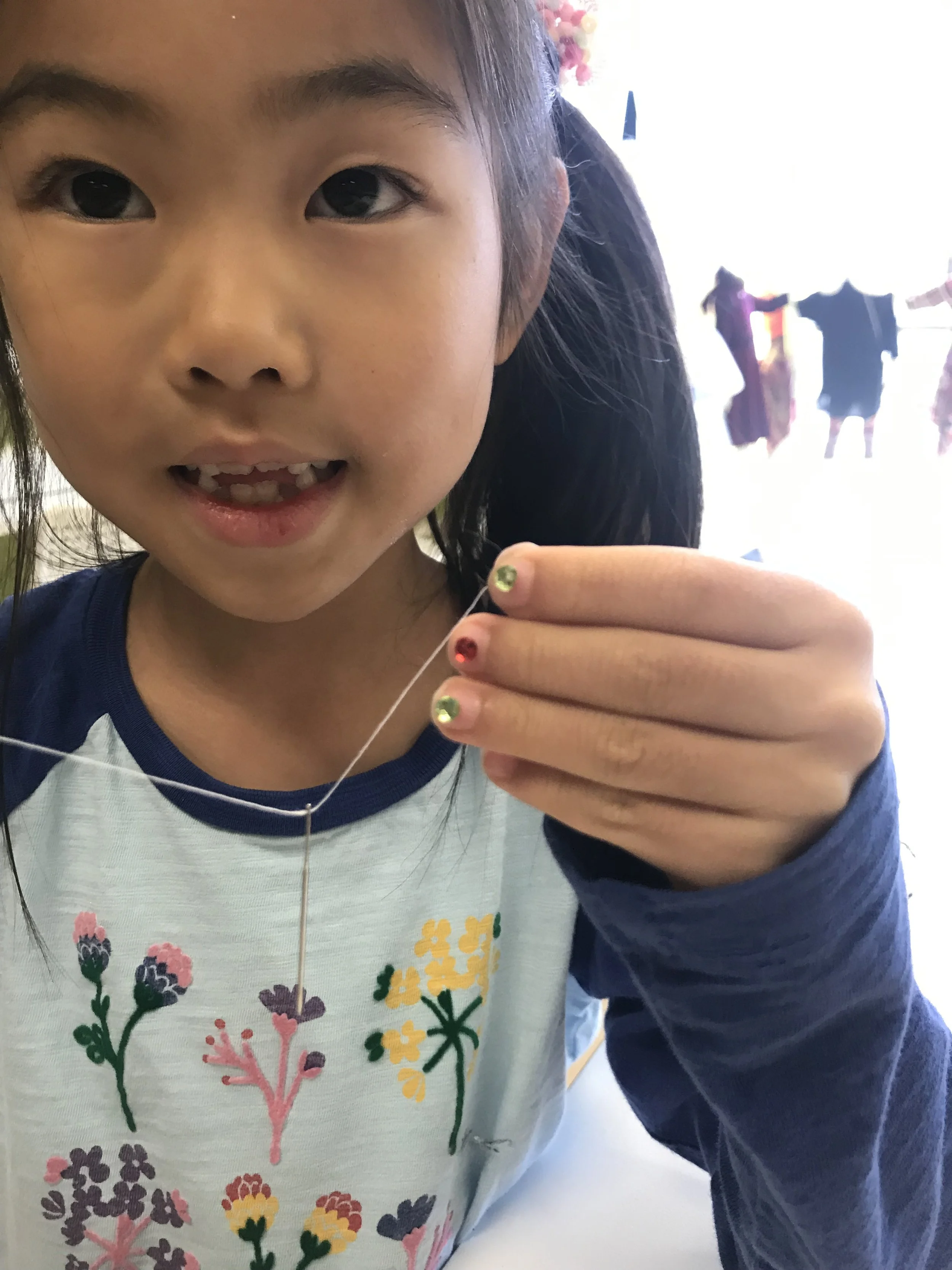 girl hand sewing.jpg
