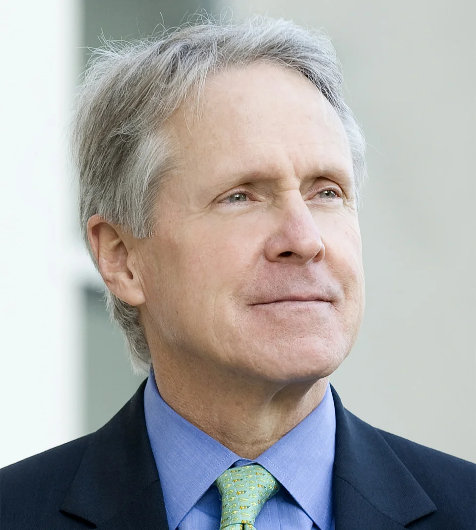 John G. Davies, President and CEO