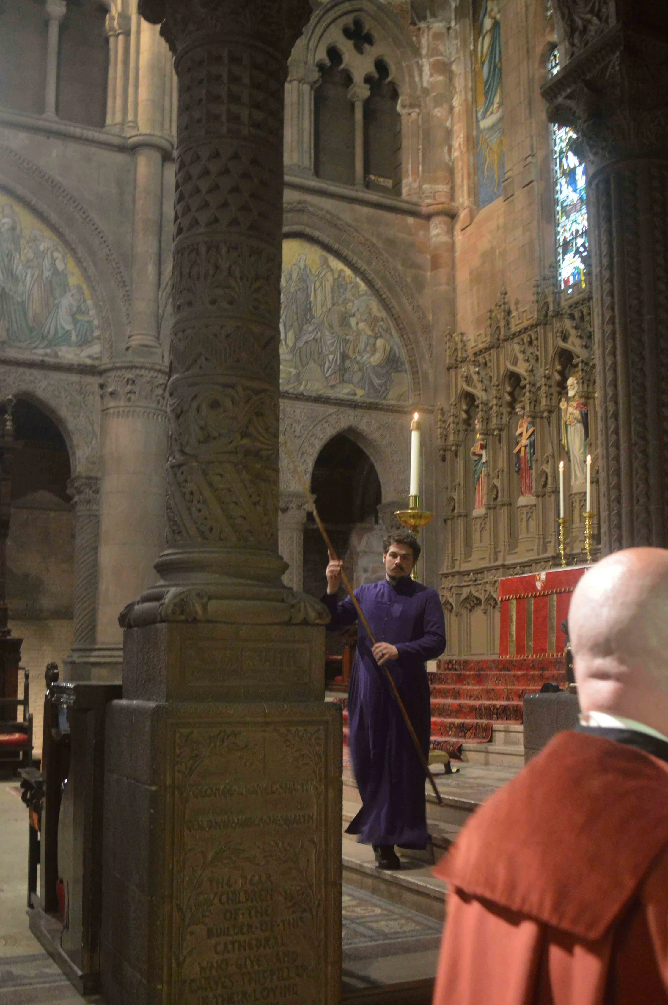 Evan Craig Reardon, one of the presenters of the T.S. Eliot workshop beginning in October, lighting candles before Evensong on June 9.