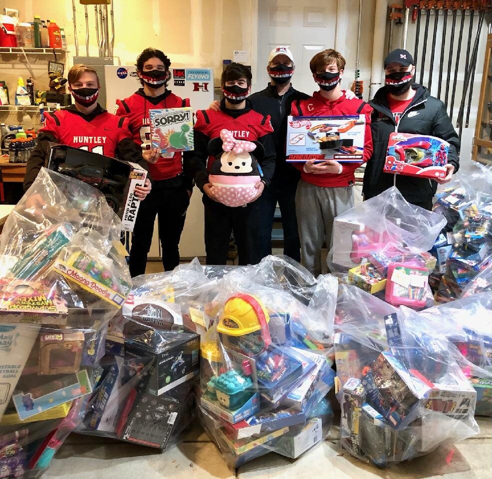 Holiday Promise - The Huntley High School Football Program conducted its 9th Annual Holiday Promise Program,donating over 463 toys and gifts to Grafton Food Pantry. The program, started by Chase Burka