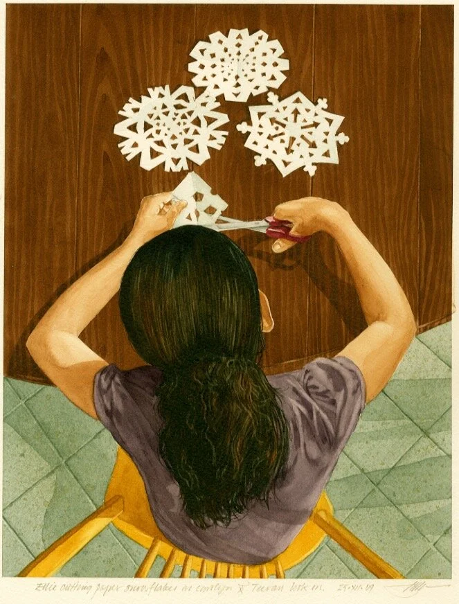 Ellie Cutting Paper Snowflakes.jpeg