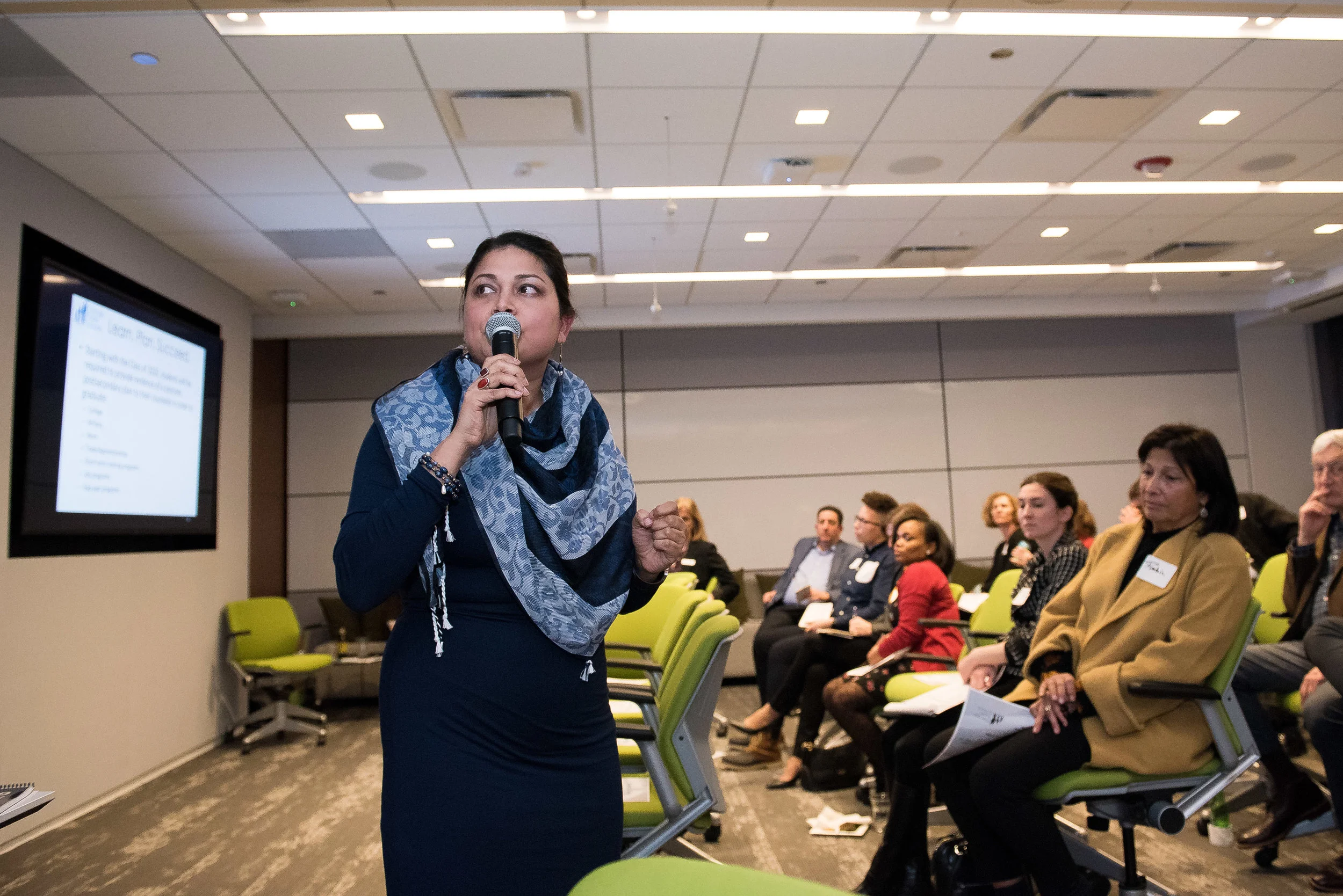 Dr. Rita Raichoudhuri presenting information around the importance of education and post-secondary planning for young people.