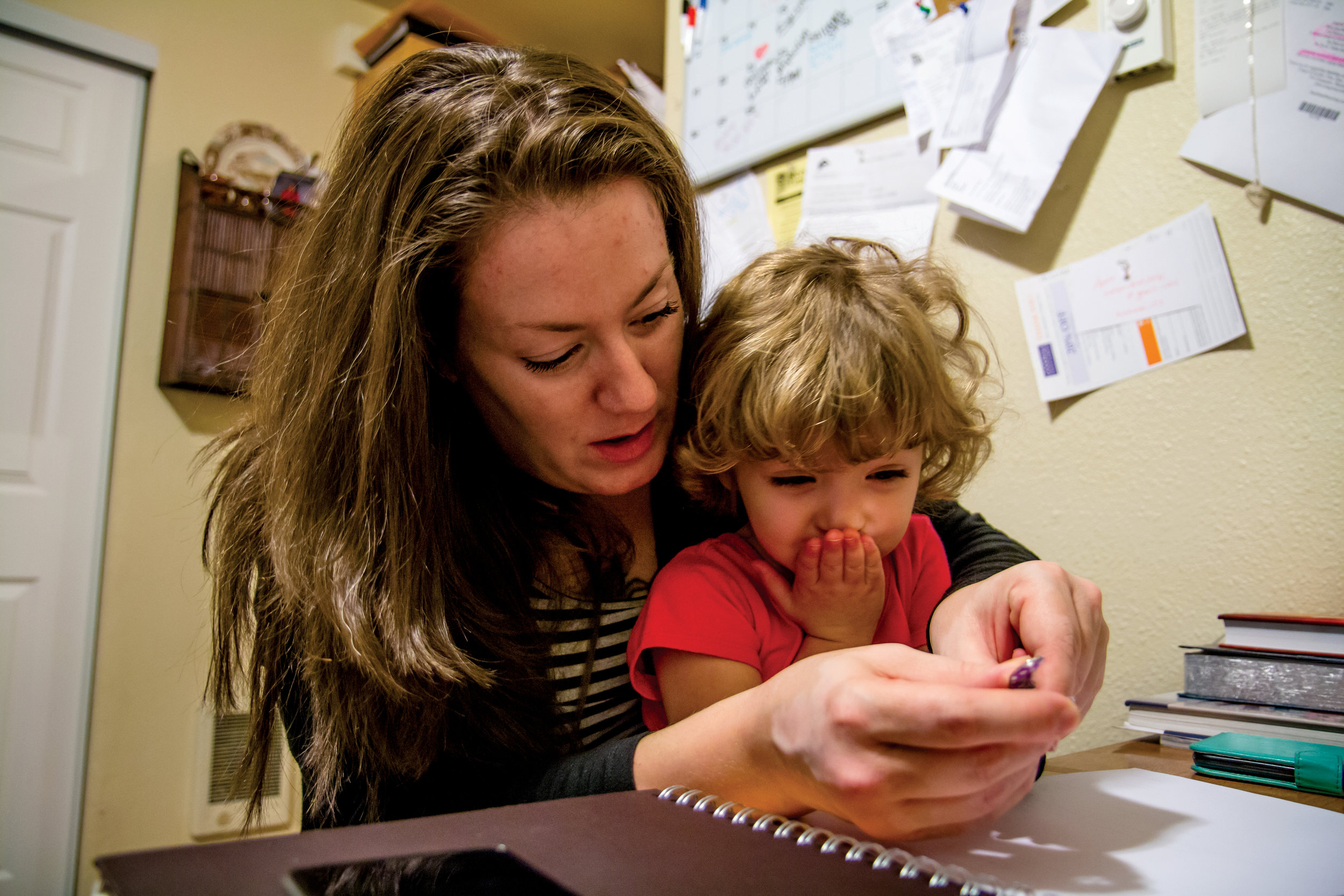   Sarah cuts Suzanna's nails before topping them with polish. Sarah counts Suzanna as her primary motivation for overcoming addiction. “She was like a new chance to be a parent and prove to the world and to myself that I really was meant to be a moth