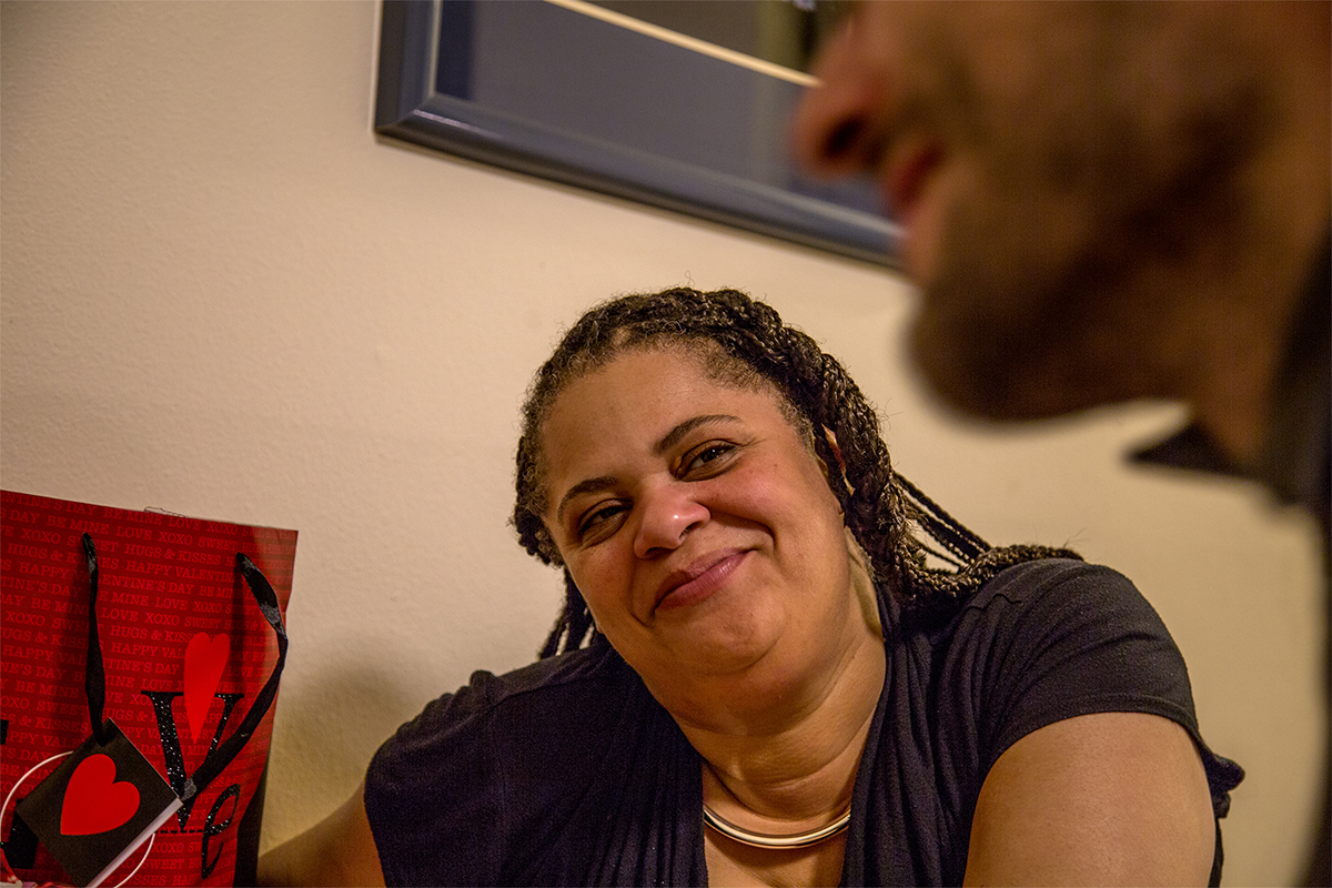  John's girlfriend Kiesha looks on at him during their Valentines Day dinner. The two have been together for nine months now. The first time he asked her out she said no, but when he came back several years later more mature she saw that and said yes