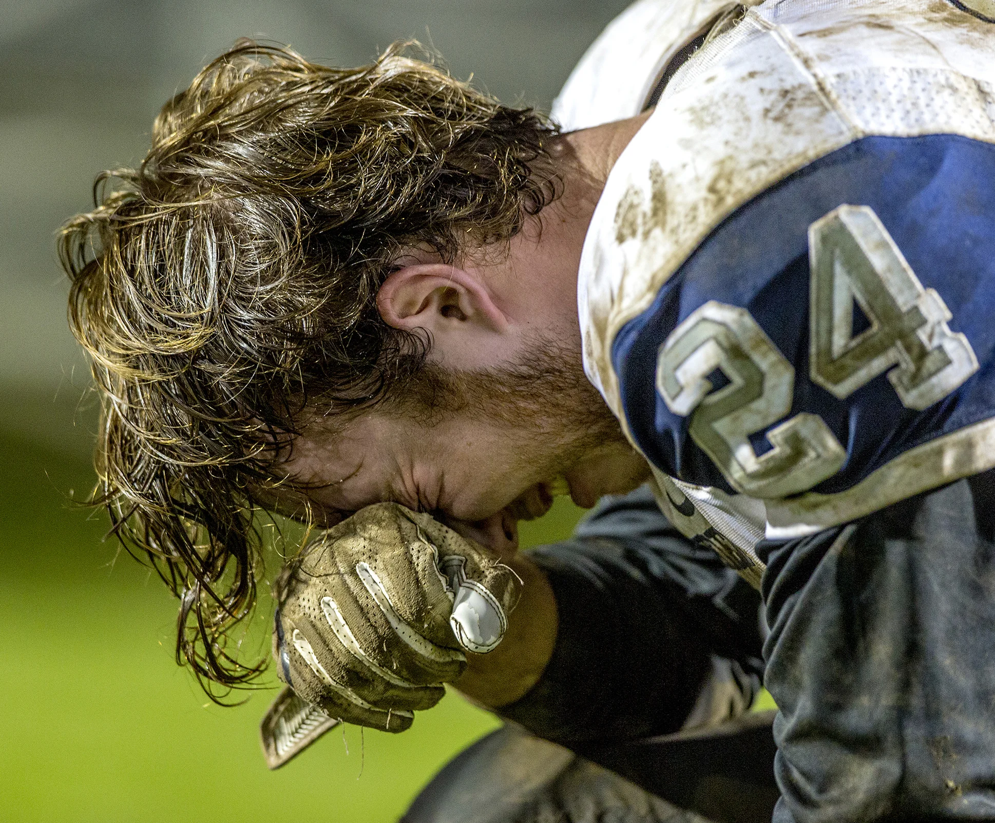 The Millers' linebacker Loudin Gariott (#24) holds his head after his team suffered a loss to Thurston High School. Springfield lost to Thurston 39-36 in the last game of the season. For seniors on the team like Gariott the last game is made even more emotional due to the chance his high school team will be the last football team he plays for. 