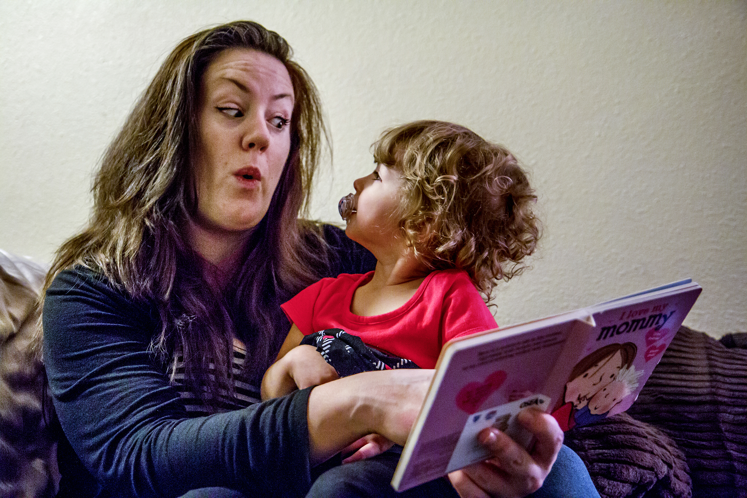  Sarah reads to Suzanna before bed, acting out faces to match the story. While the learning curve was steep, she now knows she was meant to be a mother.&nbsp; 