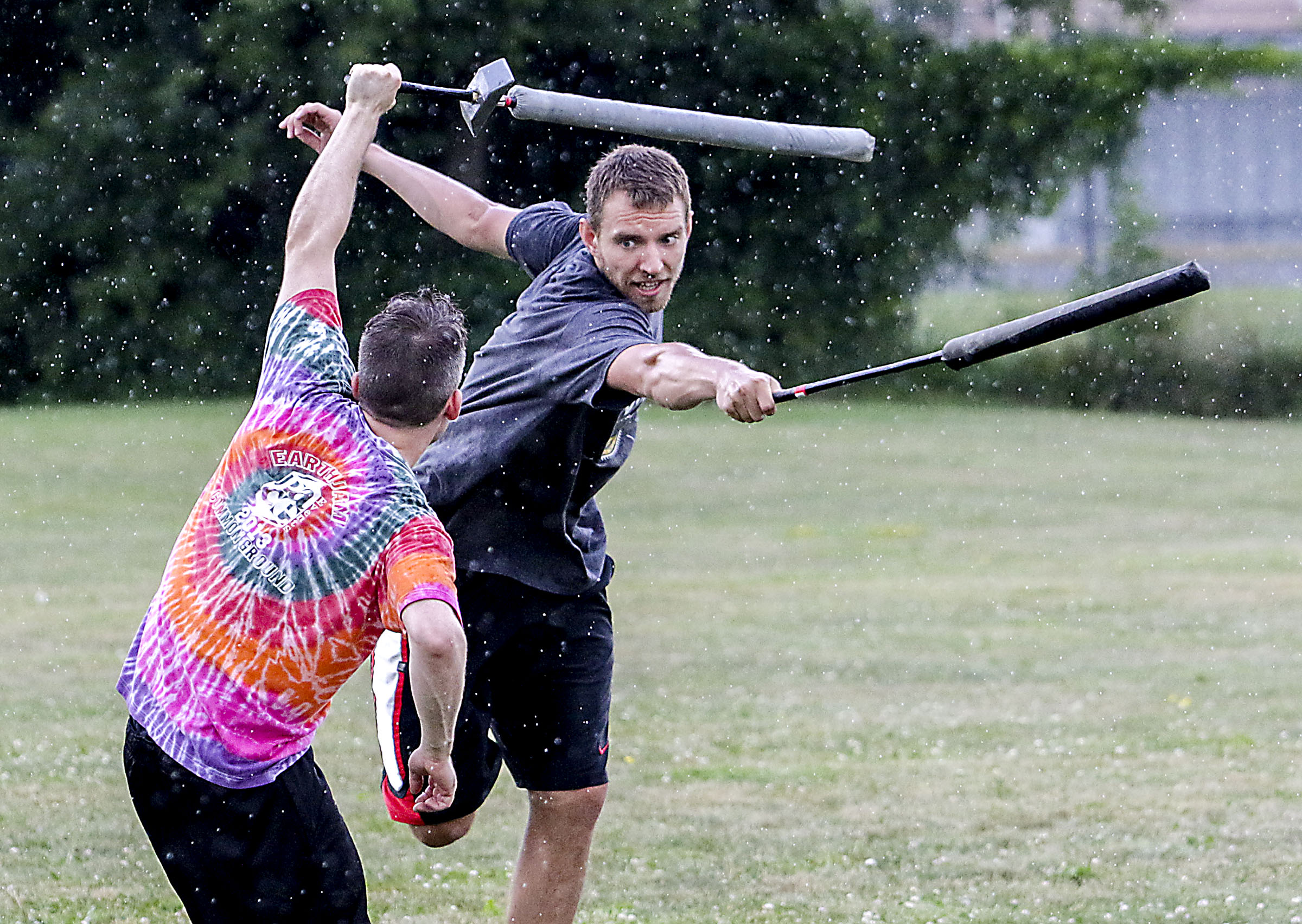  Conner Torrey keeps an eye on his opponent Seth Hurney as they practice LARPing, in the field nearby Eldrige Park in Lebanon, N.H. The two compete in the LARPing organization known as Realms and use bamboo-core weapons for increased speed and compet