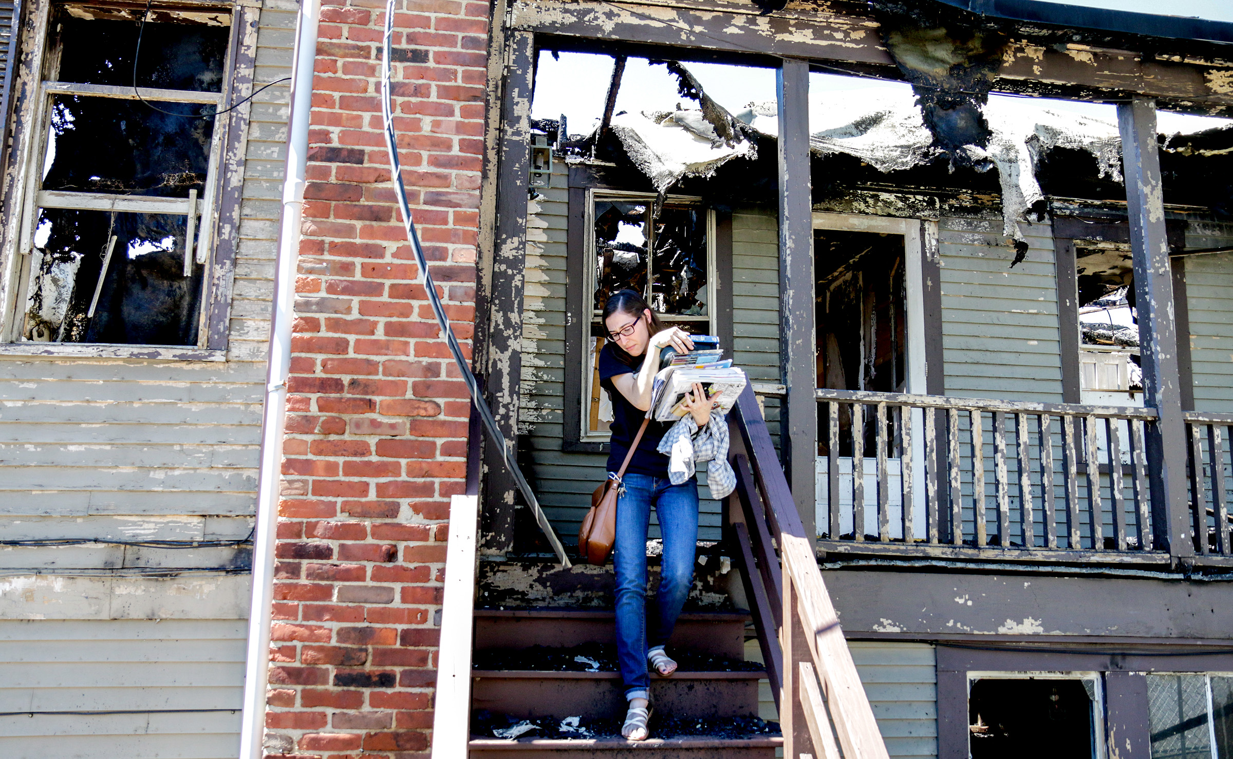  Grae O'Toole retrieves items that survived the fire that claimed her apartment in Woodstock, Vt., in addition to Pi Brick Oven Trattoria, and parts of the Vermont Standard offices. O'Toole was woken by the smoke alarms on Monday morning and dialed 9