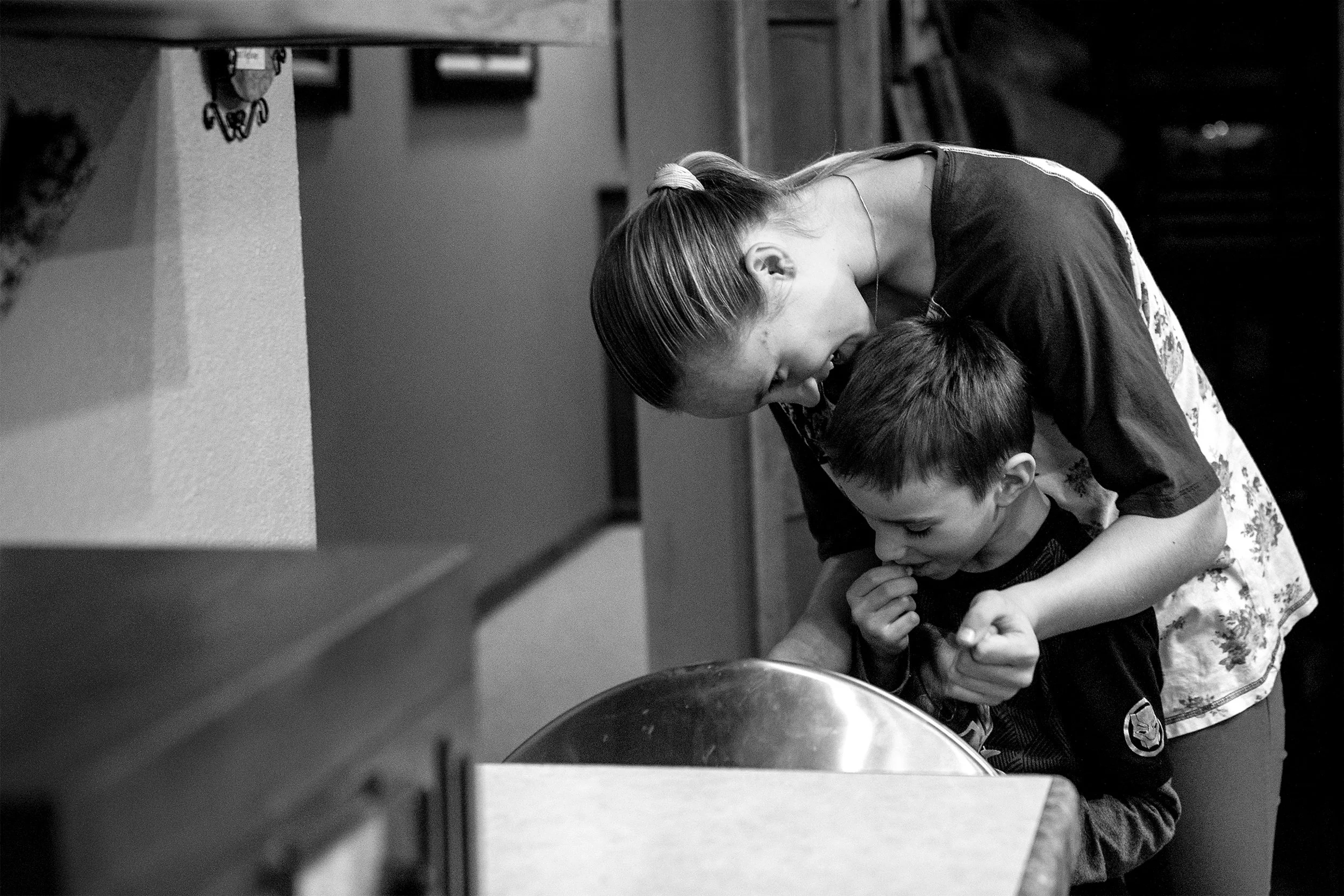  Talon Pfeil watches her brother Sasha crack peanut shells over the trash can on Wednesday, Jan. 9, 2019. "When they're here, we get so close to them. I don't want to see them leave," Talon says. 