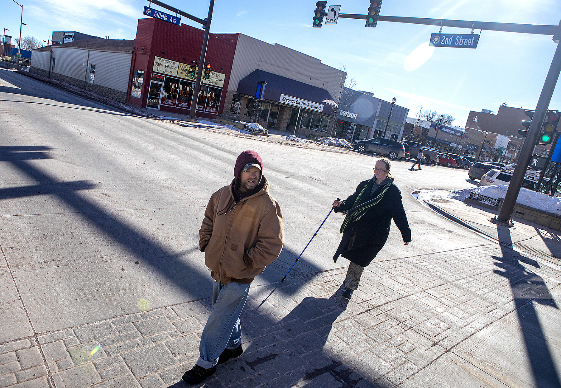  Andrea and Jeff cross second street on their walk to the Gillette Soup Kitchen on Wednesday, Jan. 30, 2019. Andre usually tries to avoid the main roads on their walks and stays vigilant of cars. They have seen a number of people, including two of Da