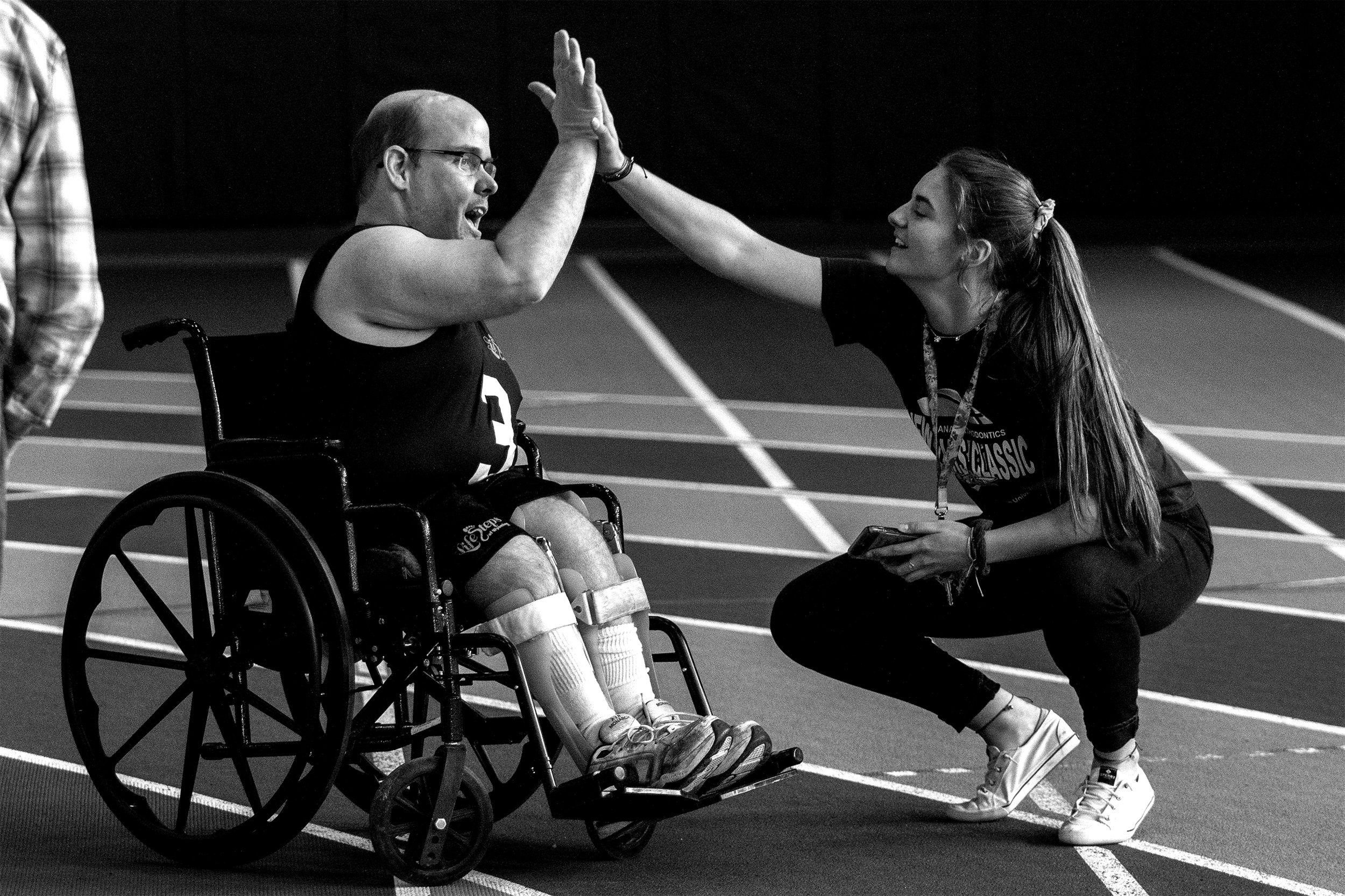  Jeff Mock receives a high five from his timekeeper Livia Castellanos after his race in wheelchair obstacle at the Rec Center on Friday, April 12, 2019. Mock was also one of two athletes to compete in weightlifting. 