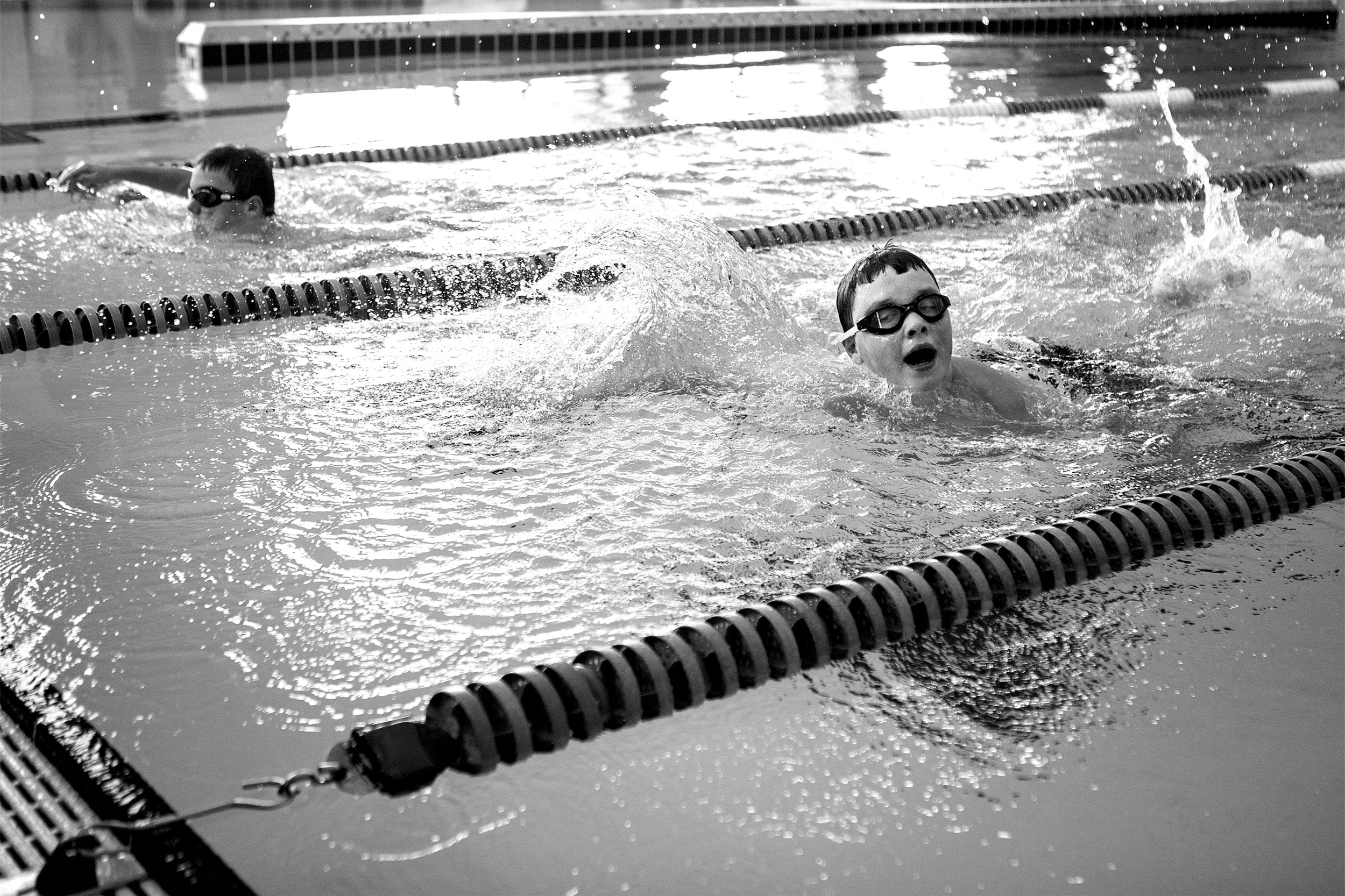  Lucas Kyle, 12, reaches for the end of the pool as he and his brother Levi, to his right, compete in the aquatics portion of the Special Olympics Area Games on Friday, April 12, 2019. 
