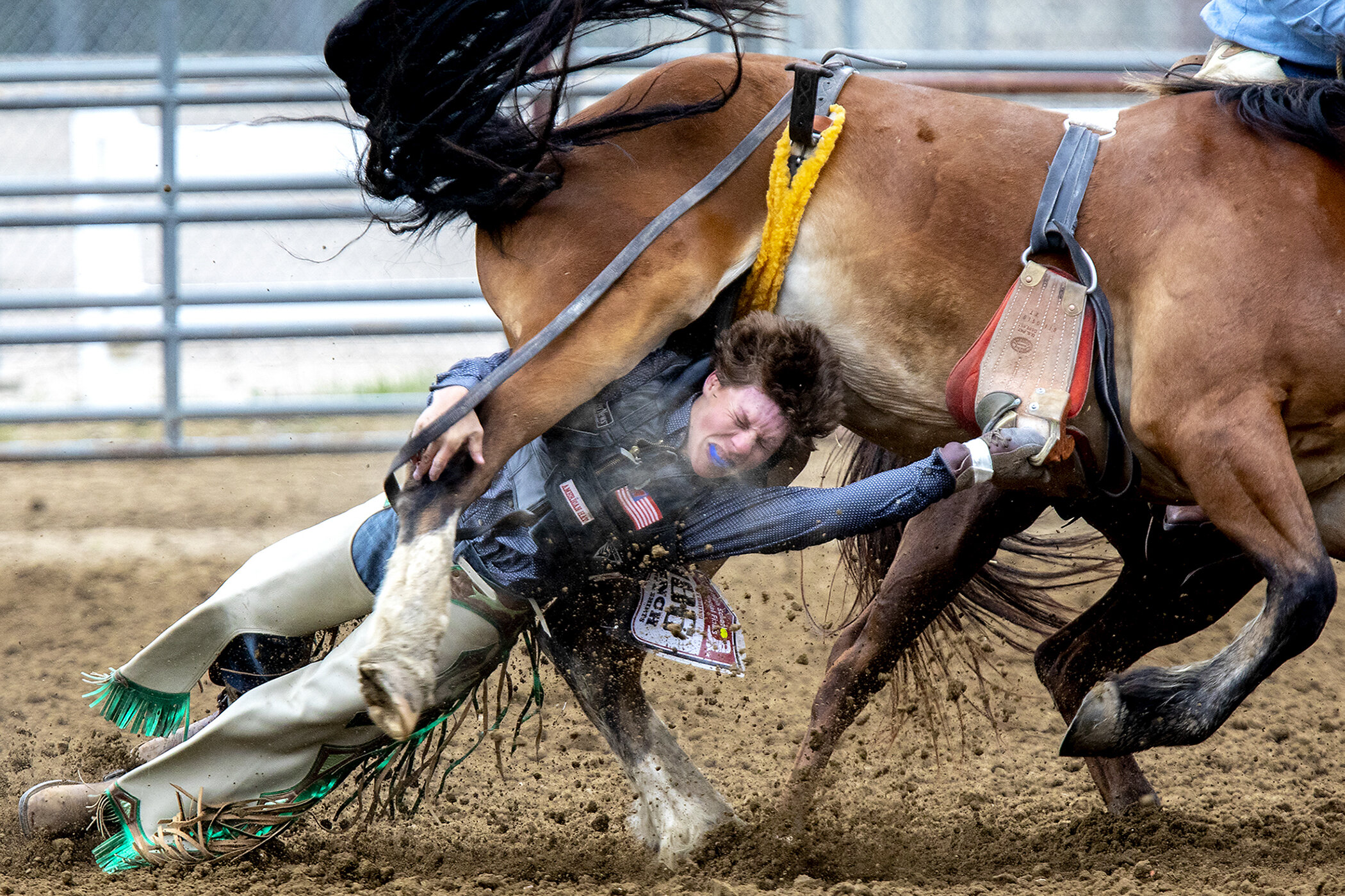 Drake Amundson, of Wheatland, gets his hand caught and is dragged under the hooves of his horse during the bareback competition of the Wyoming State Rodeo High School Finals on Saturday, June 8, 2019. EMS crews attended to Amundson who was able to s