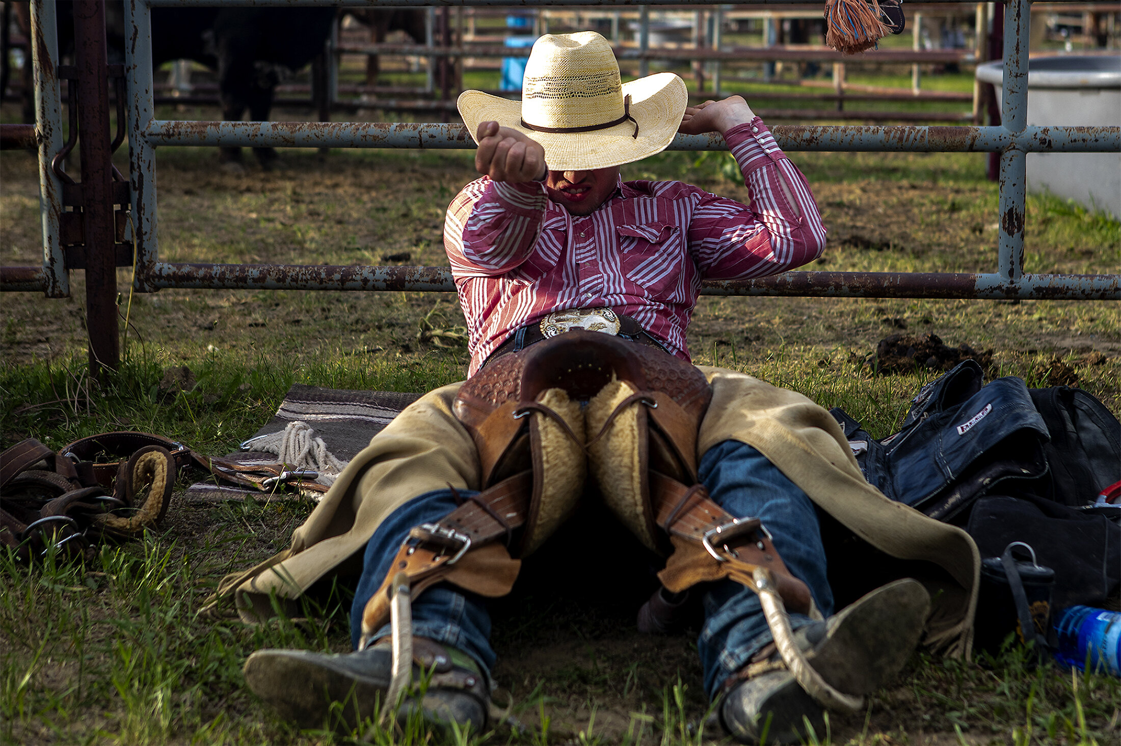  Kagen Baker tests the stirrups of his saddle as if he was riding his bucking horse ahead of competition in saddle bronc on Friday, June 7, 2019. 