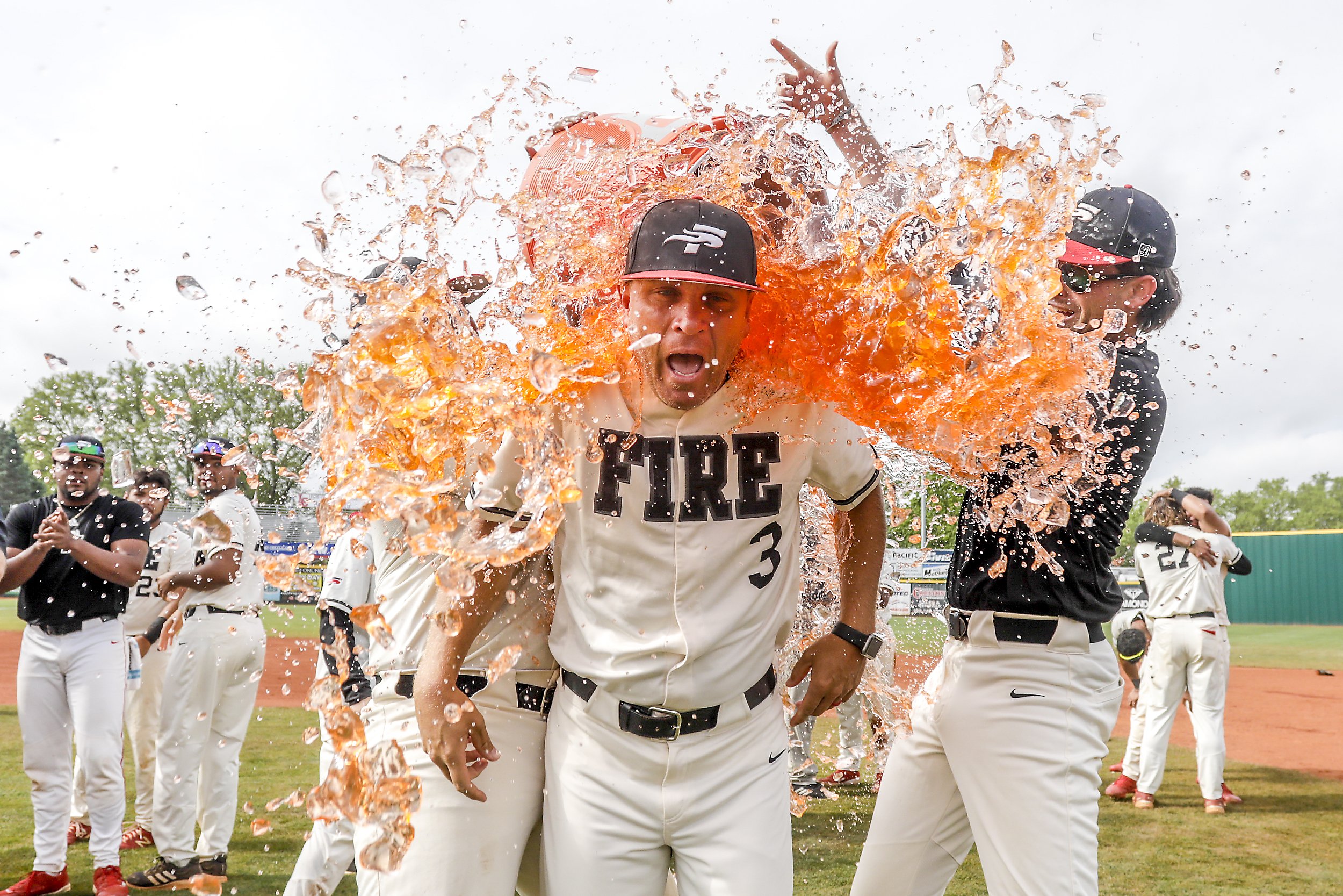  Southeastern head coach Adrian Dinkel reacts as he gets dowsed in a Gatorade bath following Southeastern’s 11-5 victory over Lewis-Clark State to win the NAIA World Series at Harris Field in Lewiston on Friday. 