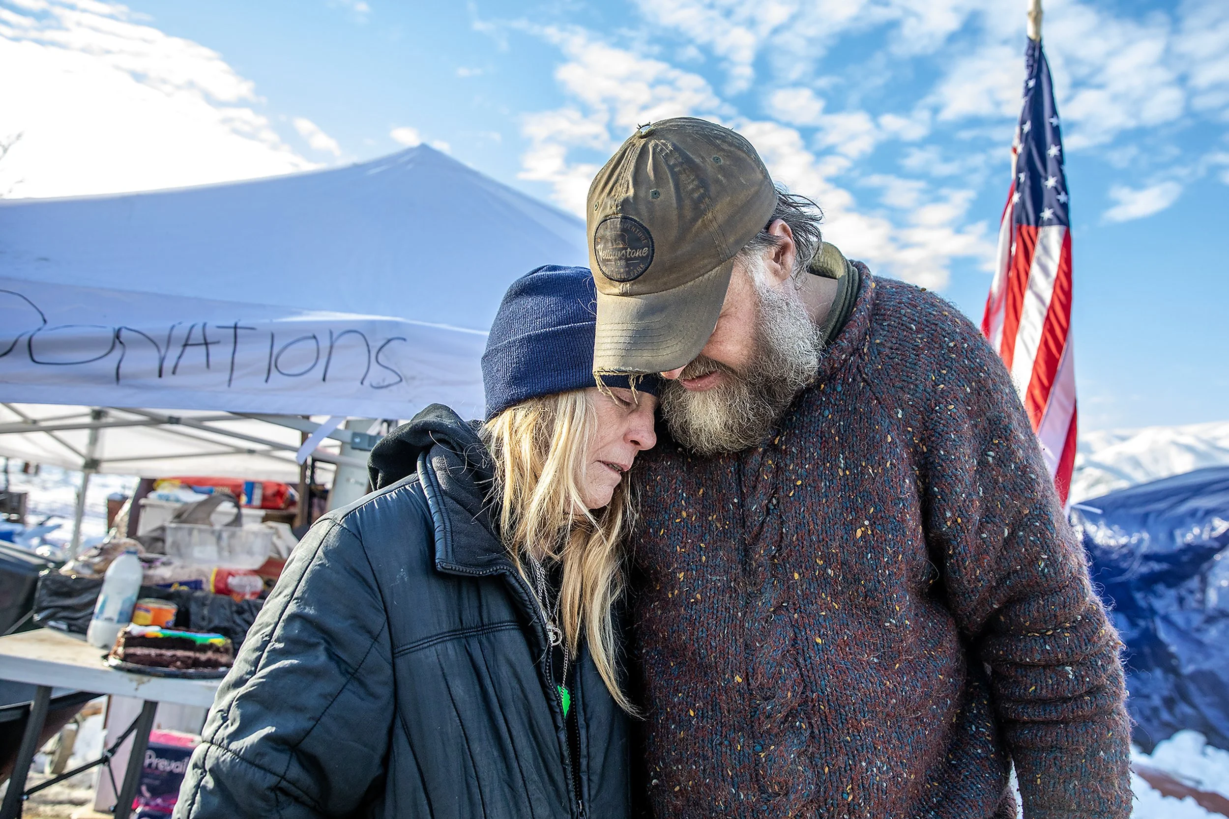  Evette Leroy embraces Tony West as they stand near the center of the homeless camp behind Walmart on Tuesday, Jan. 16, 2024, in Clarkston. Since the city told homeless residents they could stay behind Walmart around 2 and a half months ago, the camp