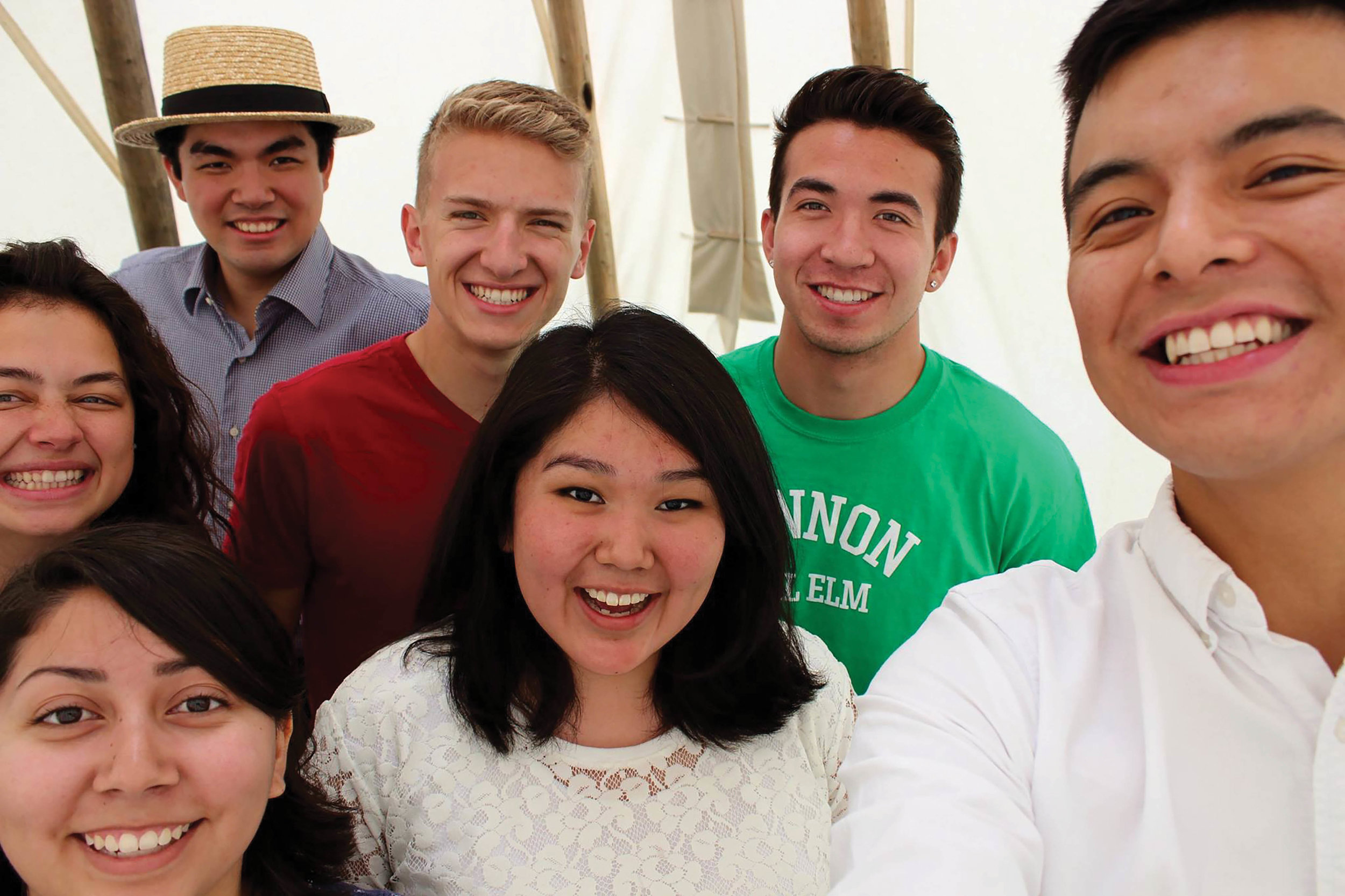 Native American Princeton students inside a tipi they built