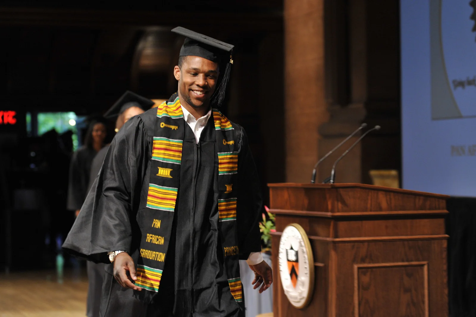 Smiling student at the Pan-African Graduation
