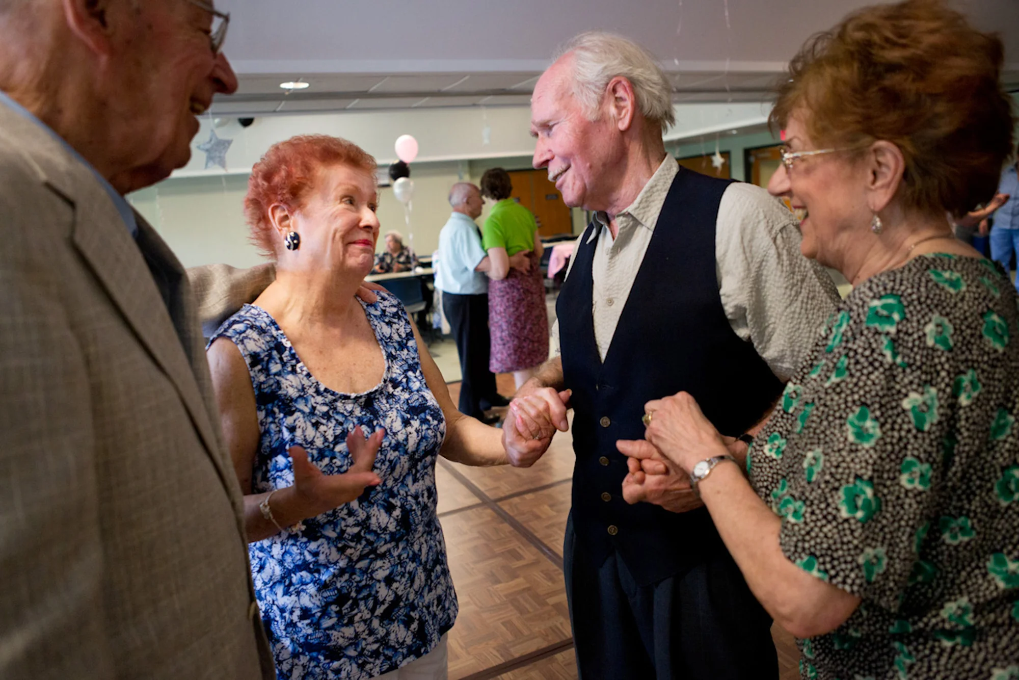 Klaus Wesenberg and his wife, Trudy, congratulate Joyce and Frank on their engagement during the Senior Sock Hop at the Greece Community and Senior Center.