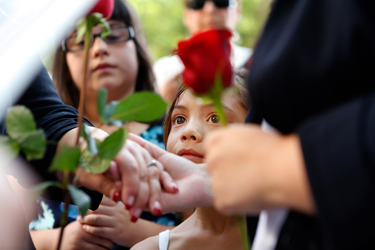  Maryjane Diaz 7, watches as her mother Erica Vargas marries Litcatzin Yoakum outside of the Kern County clerk's office in Bakersfield, Calif. Same-sex couples gathered early to receive their marriage licenses as the clerk’s office resumed issuing same-sex marriage licenses after a four-and-a-half year ban implemented by Proposition 8 was uplifted.