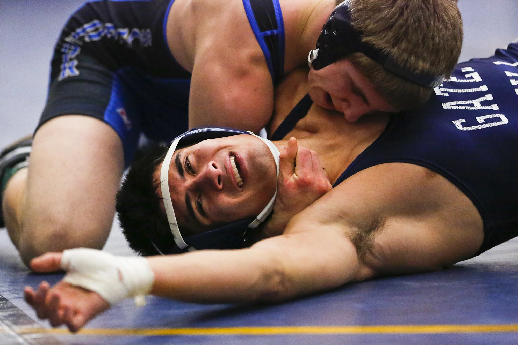 Sam Vacchetto of Webster Schroeder Warriors defeats Christian Ferrante during the quarter finals at the Monroe County League Wrestling Championship in Webster, N.Y.