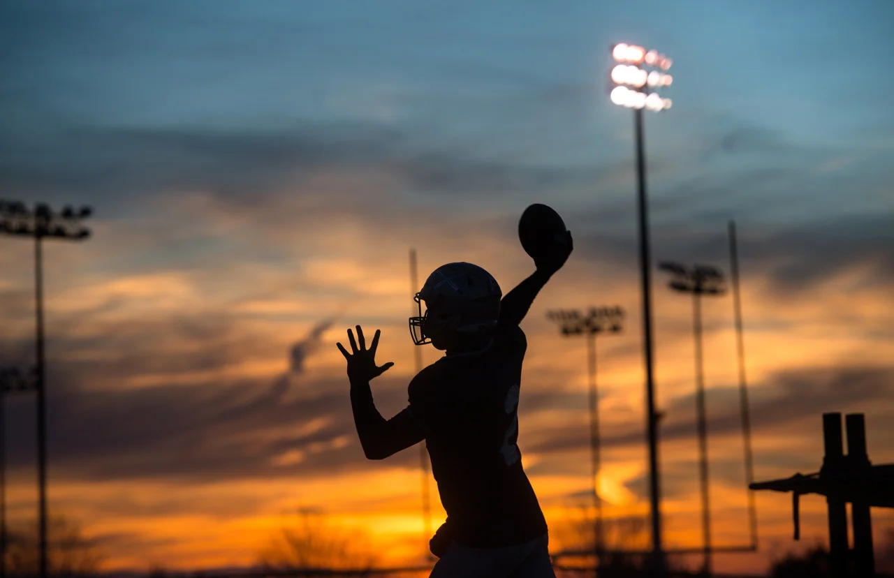 Quarterback Matt Page II passes the ball to a teammate during practice at Appomattox High School in Appomattox, Va. The Appomattox Raiders, who remain undefeated (12-0), will host Richlands (11-1). 