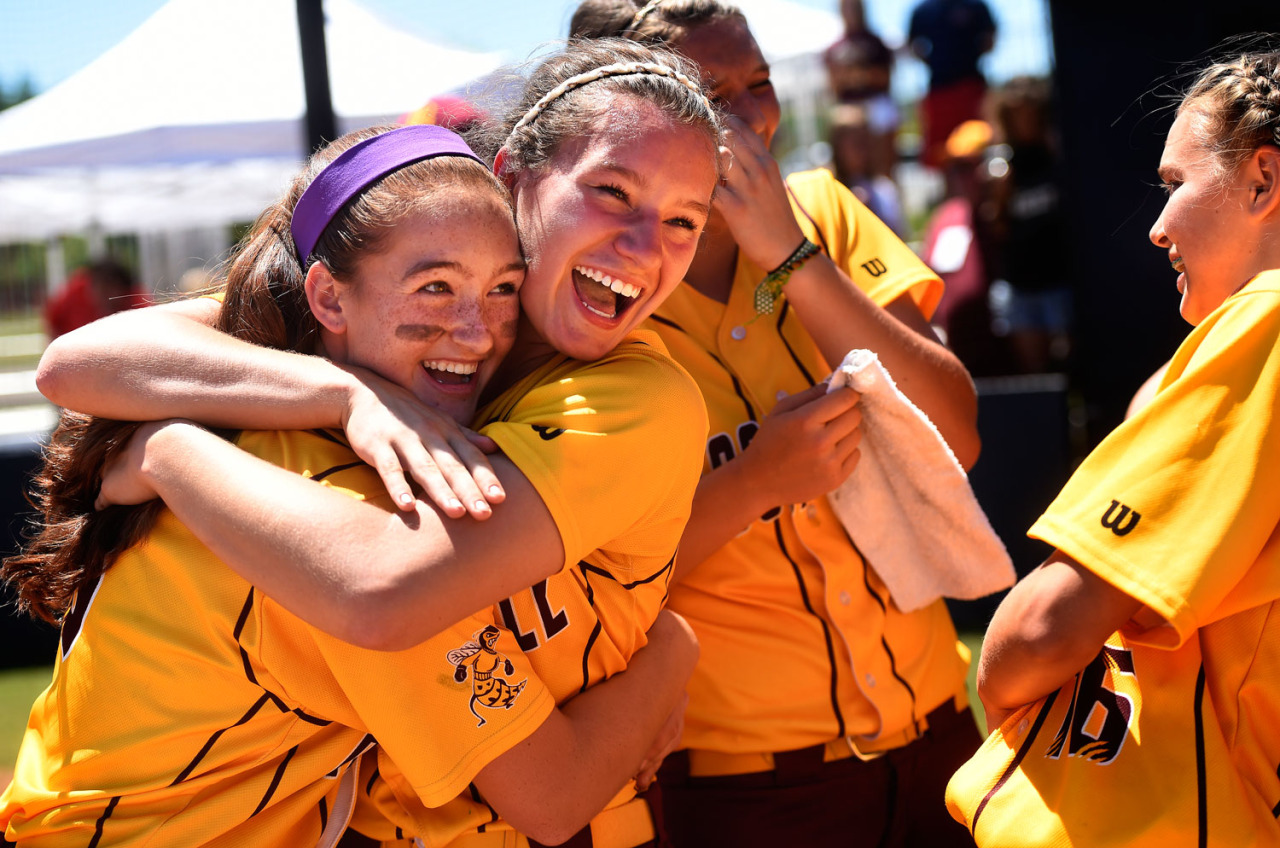 Jordyne Vance (left) hugs Jordan Dail after the Brookville Bees won the 2014 VHSL 3A Softball State Championships against the Turner Ashby Knights at Liberty University in Lynchburg, Va.