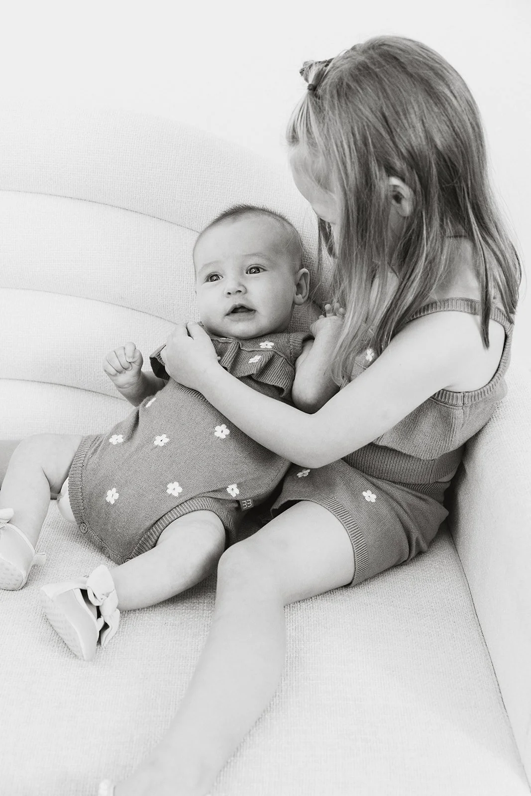 Parents and children laughing during a studio family photo session