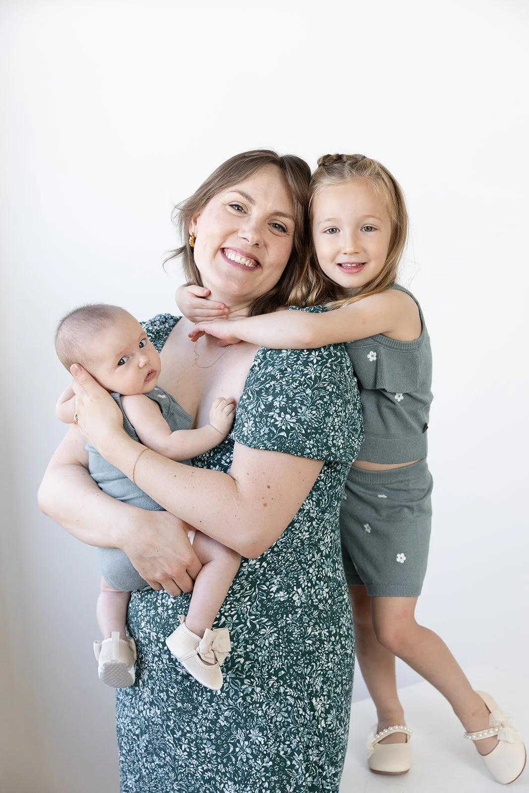 Parents and children laughing during a studio family photo session