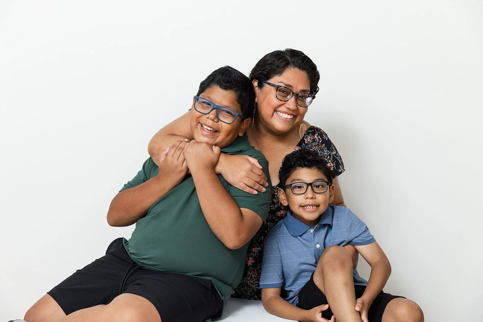 Parents and children laughing during a studio family photo session
