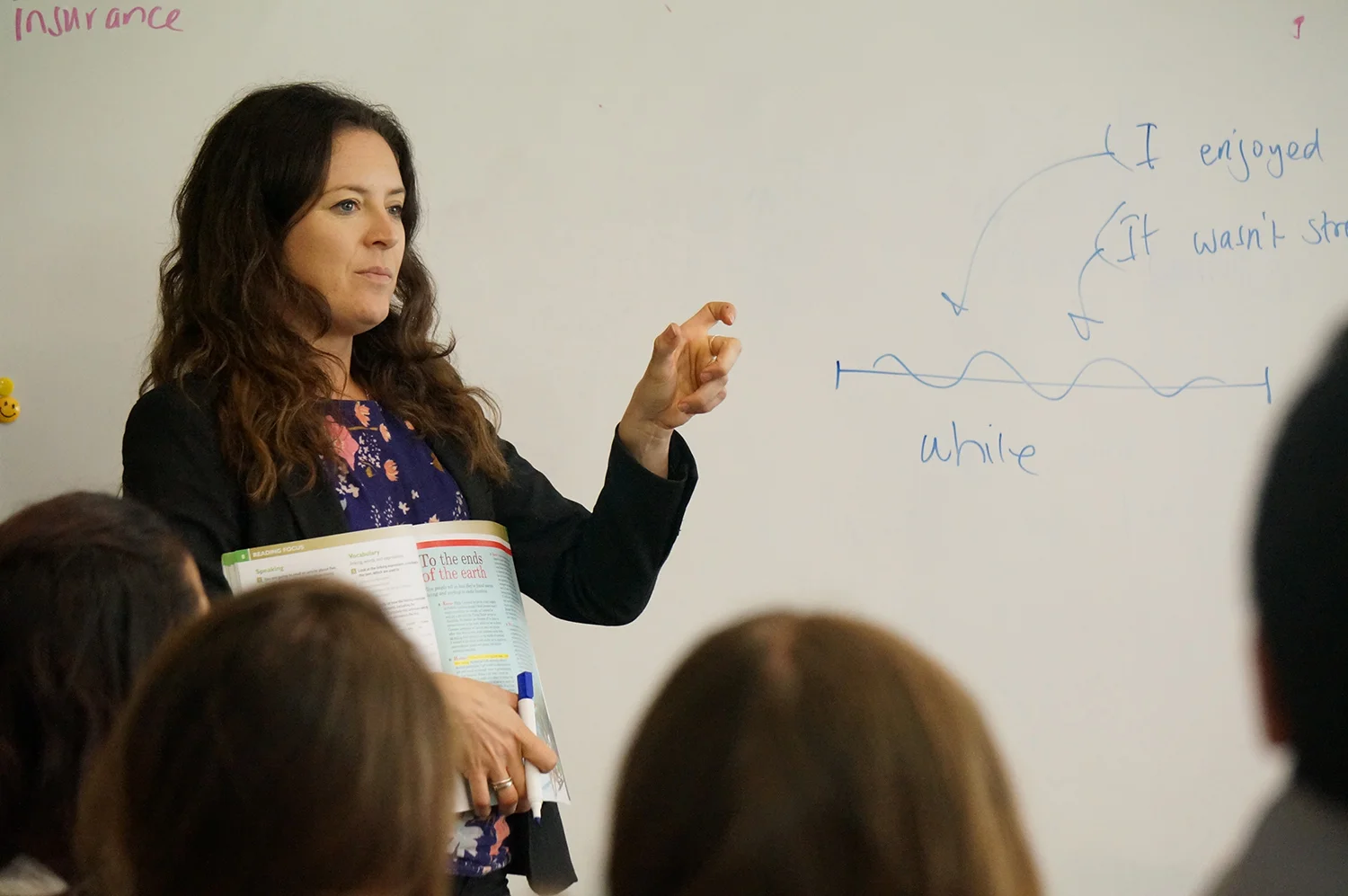 teacher-helping-student-english-class.jpg