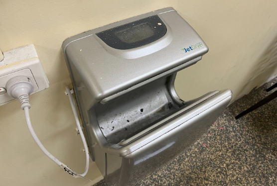 The unbelievable state of the hand dryers in the girls' bathroom; some would rather have wet hands all day