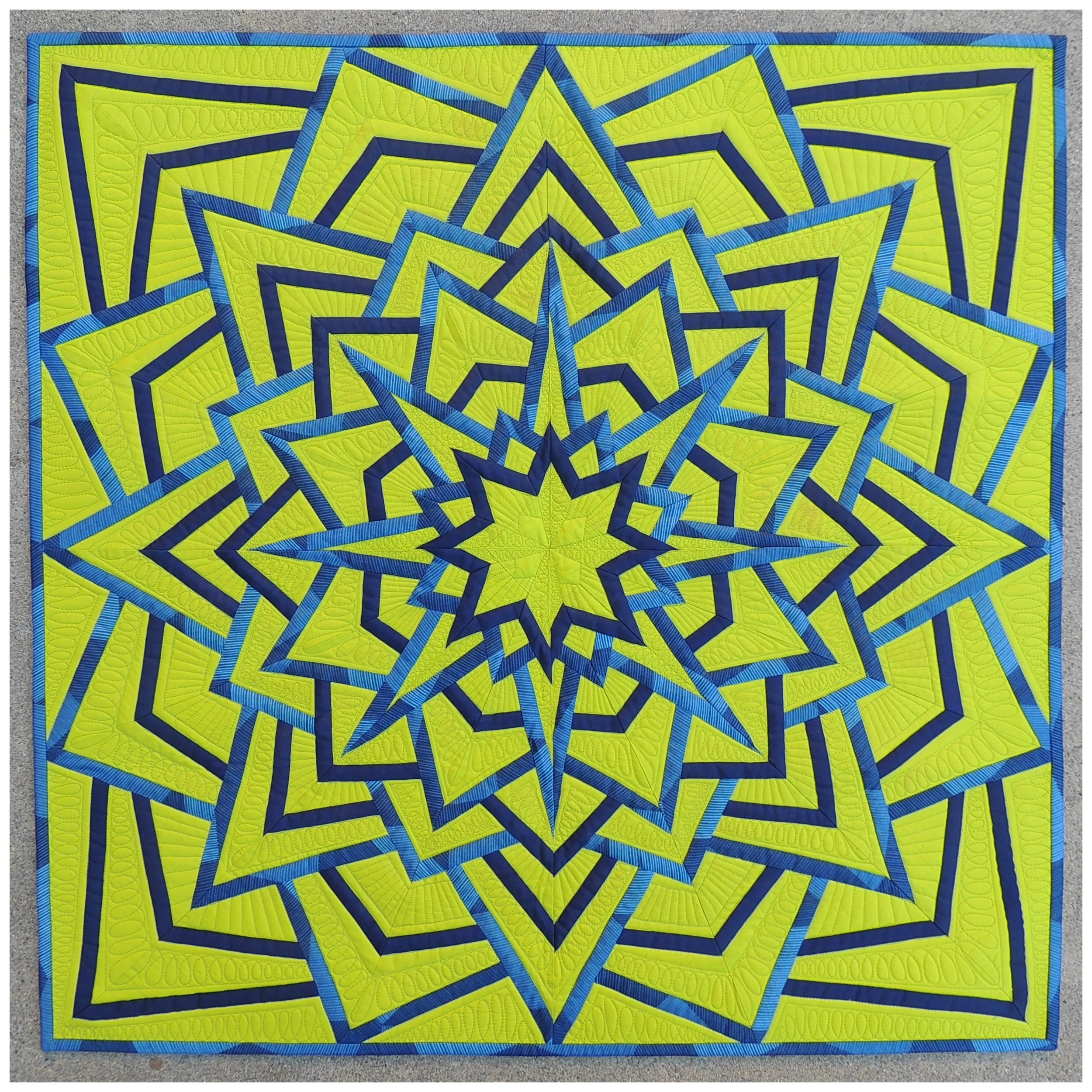 13. Lime Light, Star Bright November 2016 31" x 31" Pieced Modern Mandala made using Michael Miller solids & prints. Exhibits/Awards: 2nd Place in Pieced Quilts at the California State Fair (July 2018), juried into Quilt Con (February 2017) and Pacific International Quilt Festival (October 2017). Blog Post