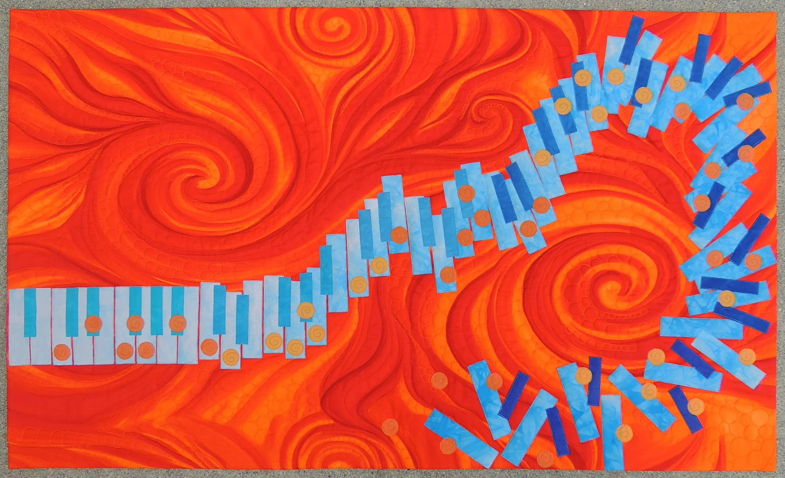 7. Orange You Glad I Got the Blues? April 2016 40" x 24" Original applique design using hand dyed fabrics and a commercial print to simulate the improvisational nature of Jazz Music. Exhibits/Awards: Juried into International Quilt Festival (November 2018), 2nd Place in California State Fair in the Art Quilts Small Category (July 2017), won Honorable Mention Ribbon at Pacific International Quilt Festival (October 2016), juried into Jazz Impressions Exhibit at the San Jose Museum of Quilts & Textiles (May 2016). Blog Post