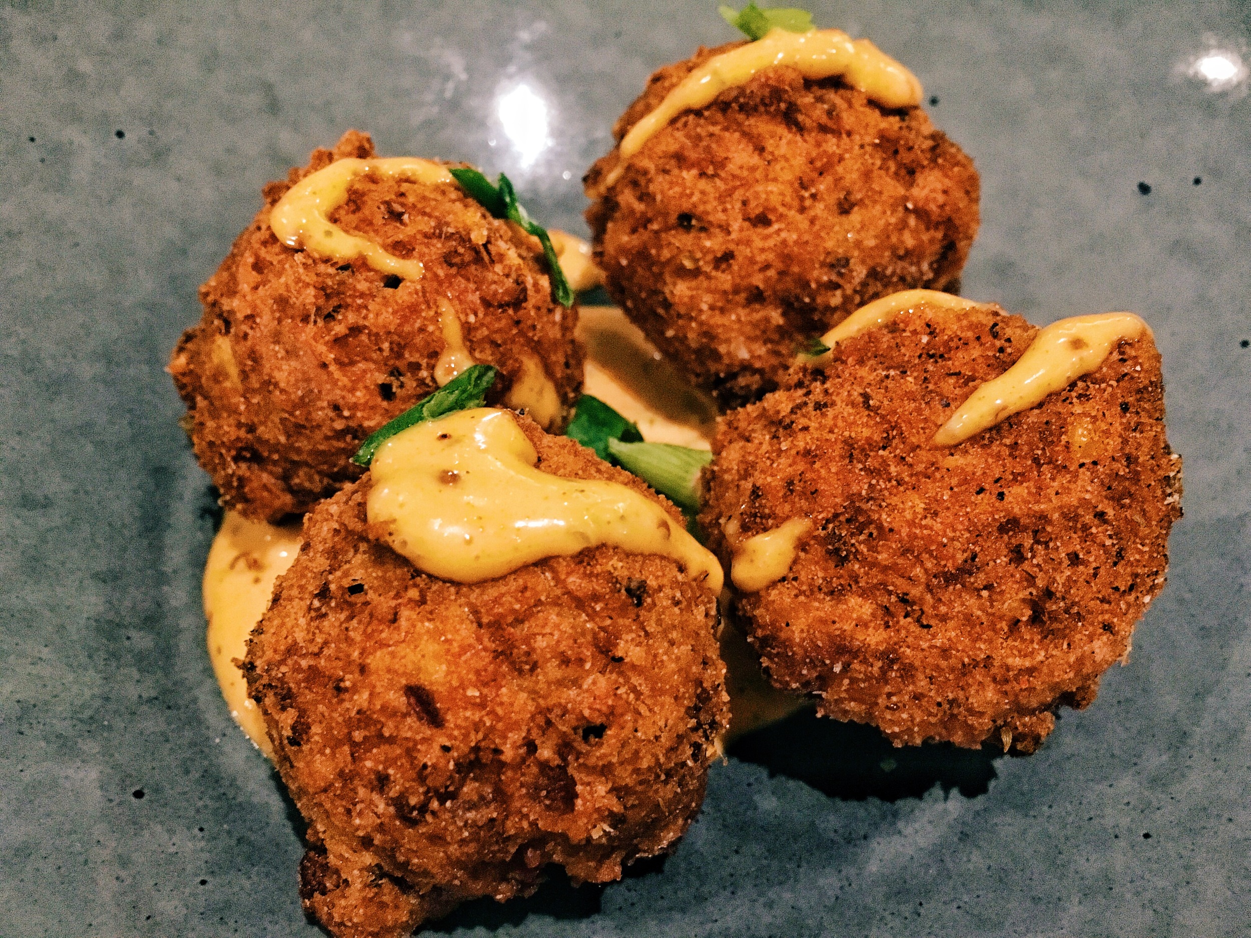 Spicy crawfish and corn beignets ($1 each for happy hour)