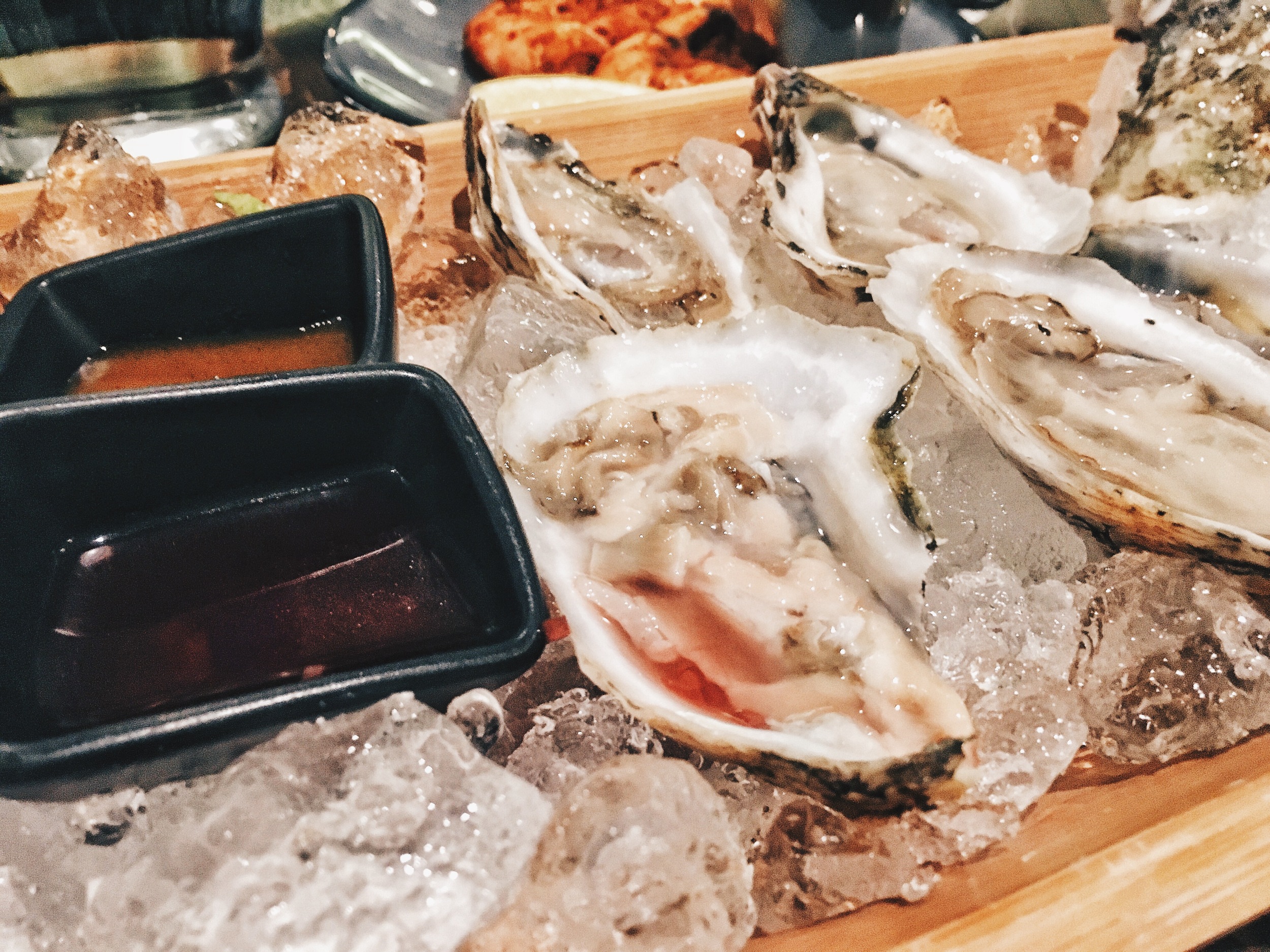 Oysters with hot sauce, mignonette, lemon and house remoulade ($1 each for happy hour)