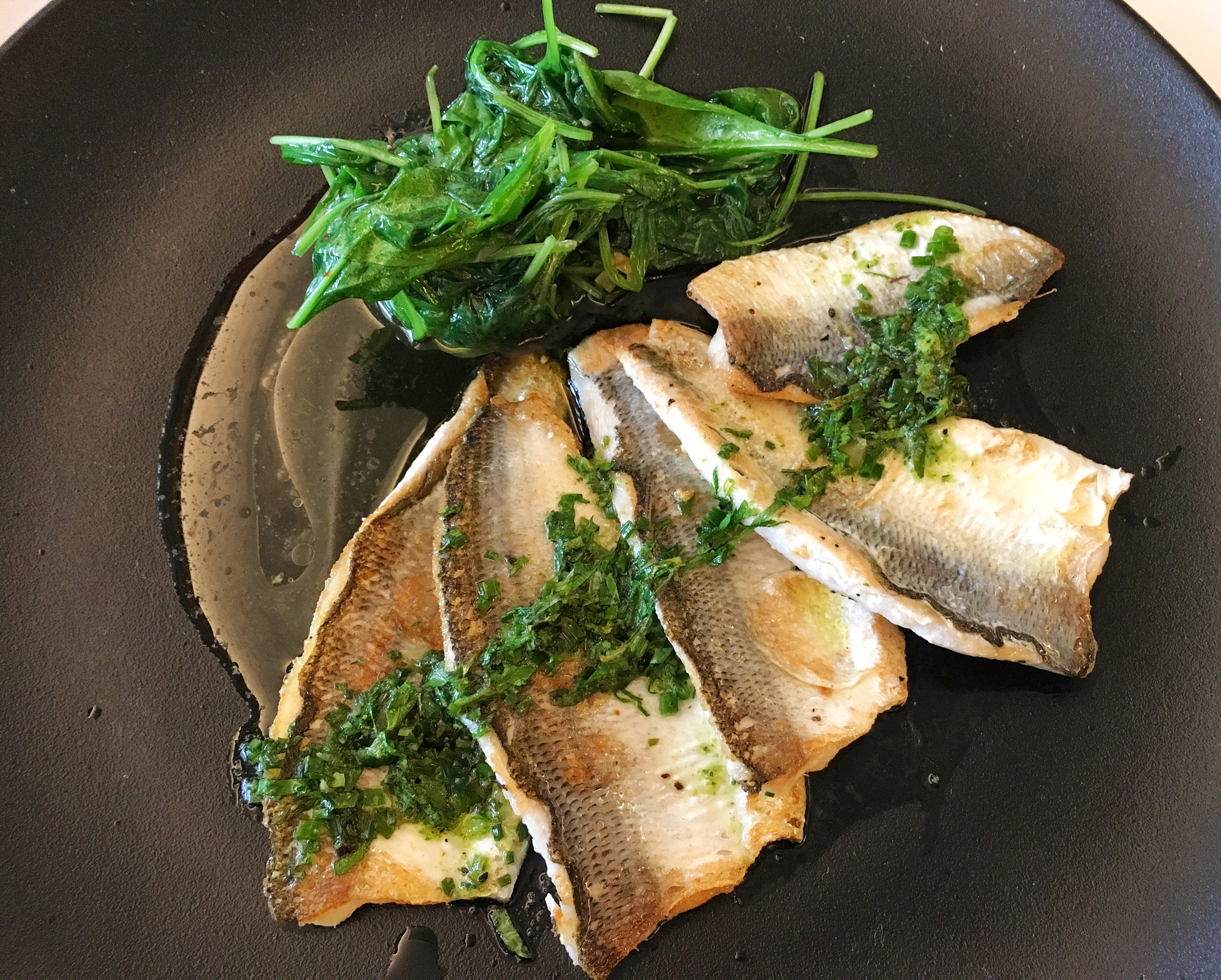 Grilled perch from the Lake of Zug sautéed in butter with spinach and boiled potatoes (not shown)