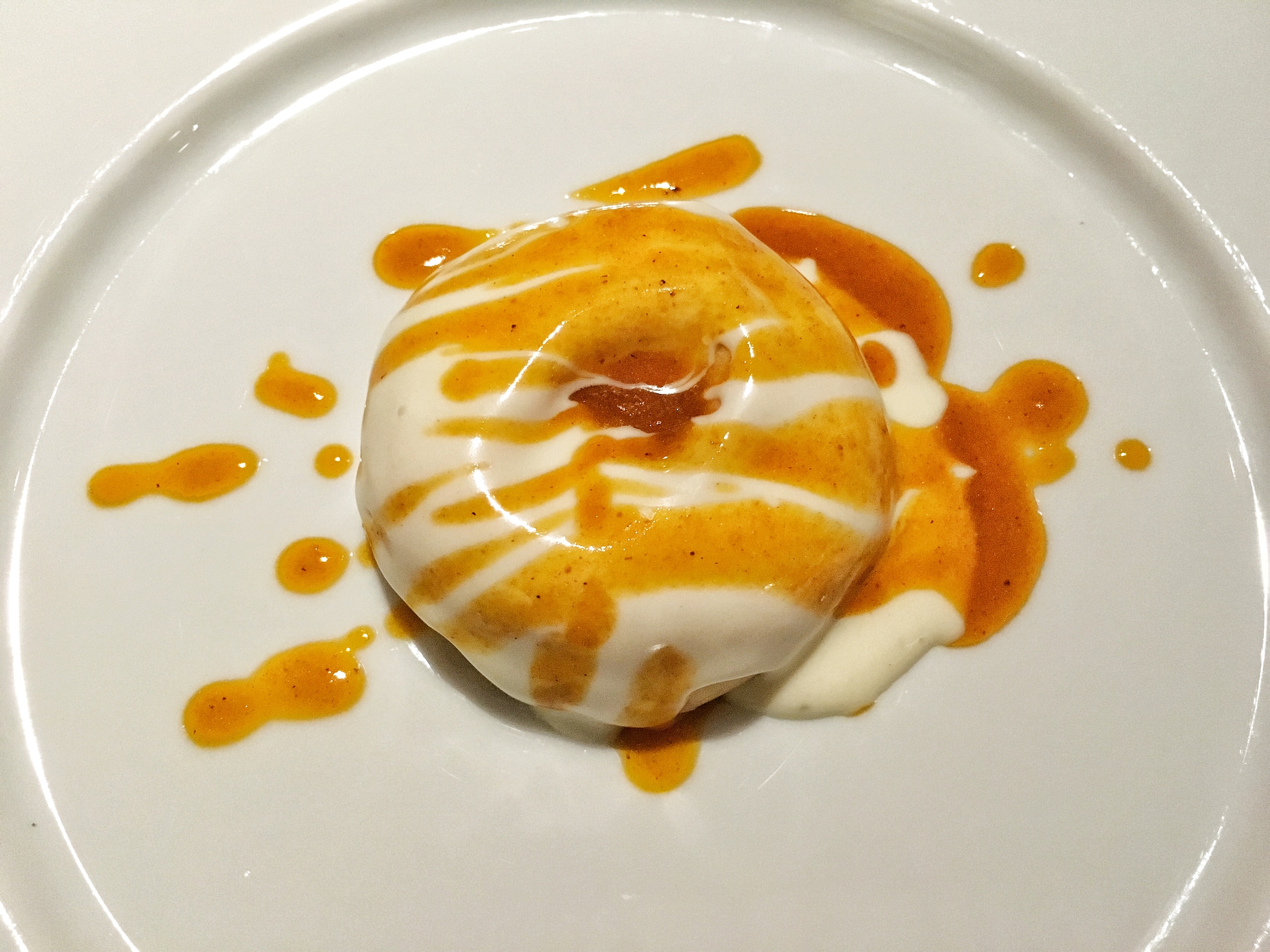 Donut filled with beef ragu and topped with béchamel