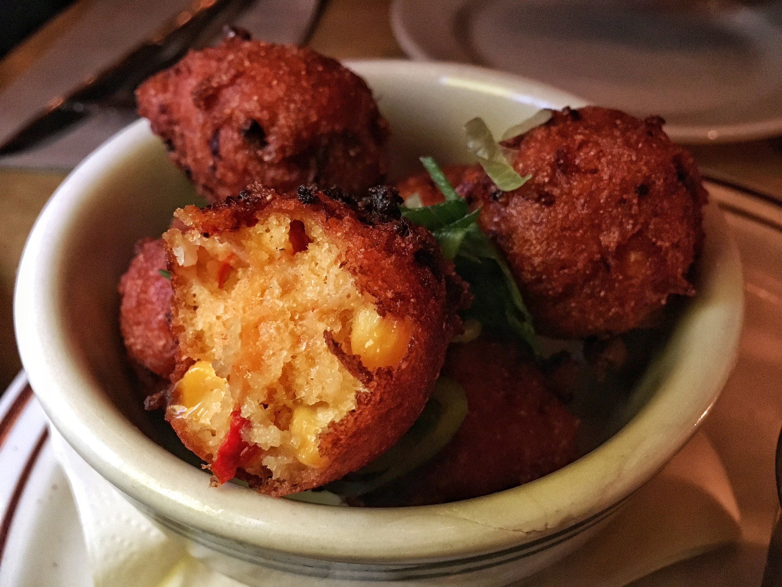 Crawfish hush puppies with remoulade sauce and jalapeño jam