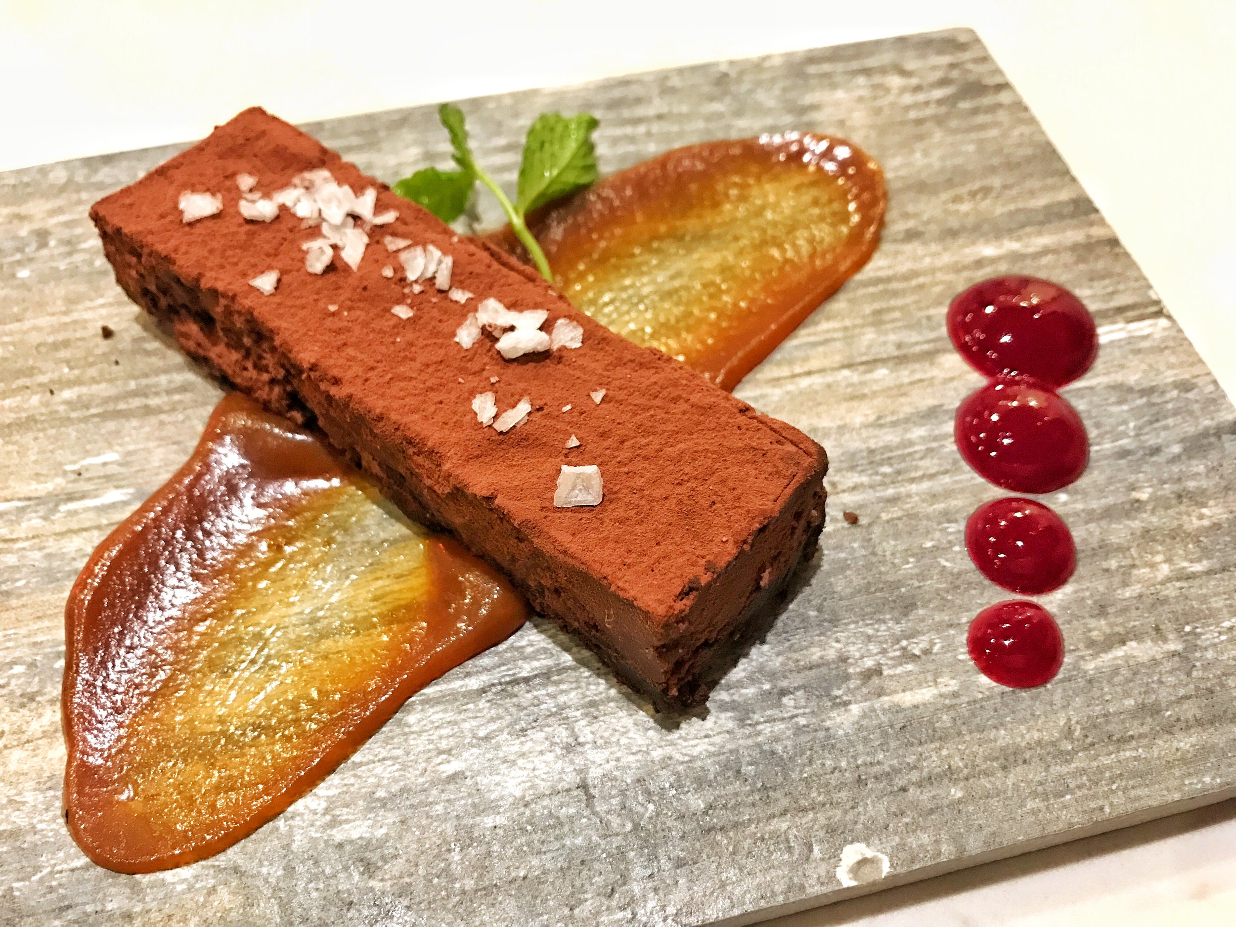 Triple chocolate espresso torte with western slope plum coulis
