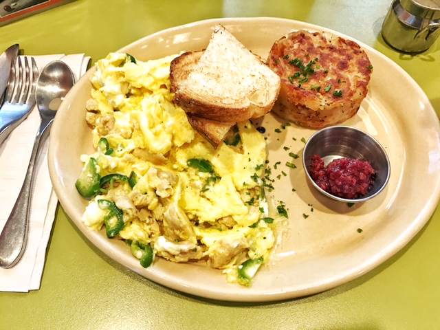 Egg scramble with jalapeños, chicken sausage and goat cheese with a side of sourdough toast and home fries
