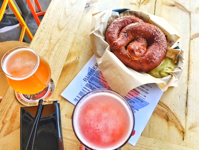 Local brew, pretzel with spicy deli mustard