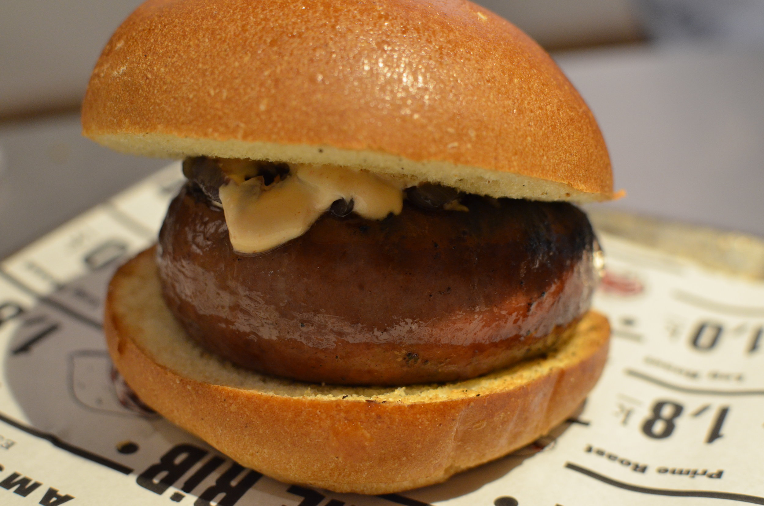 Who let the dogs out- 100% beef hot dog with grilled onions & The Butcher sauce.