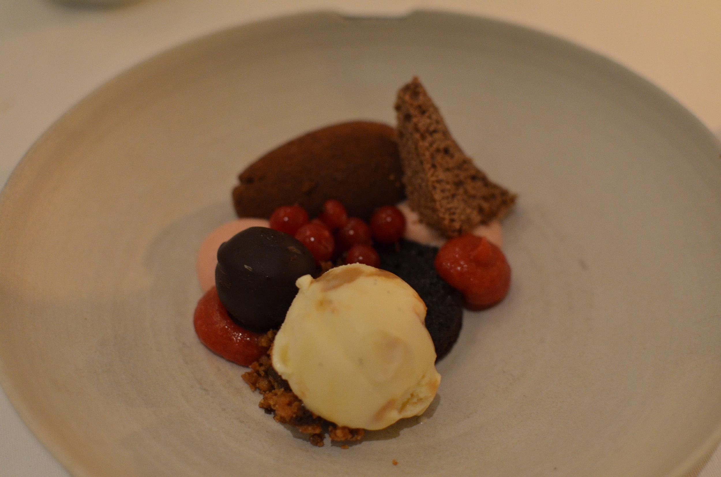 Chocolate mousse with red berries, dolce di latte ice-cream and sauce of hazelnut