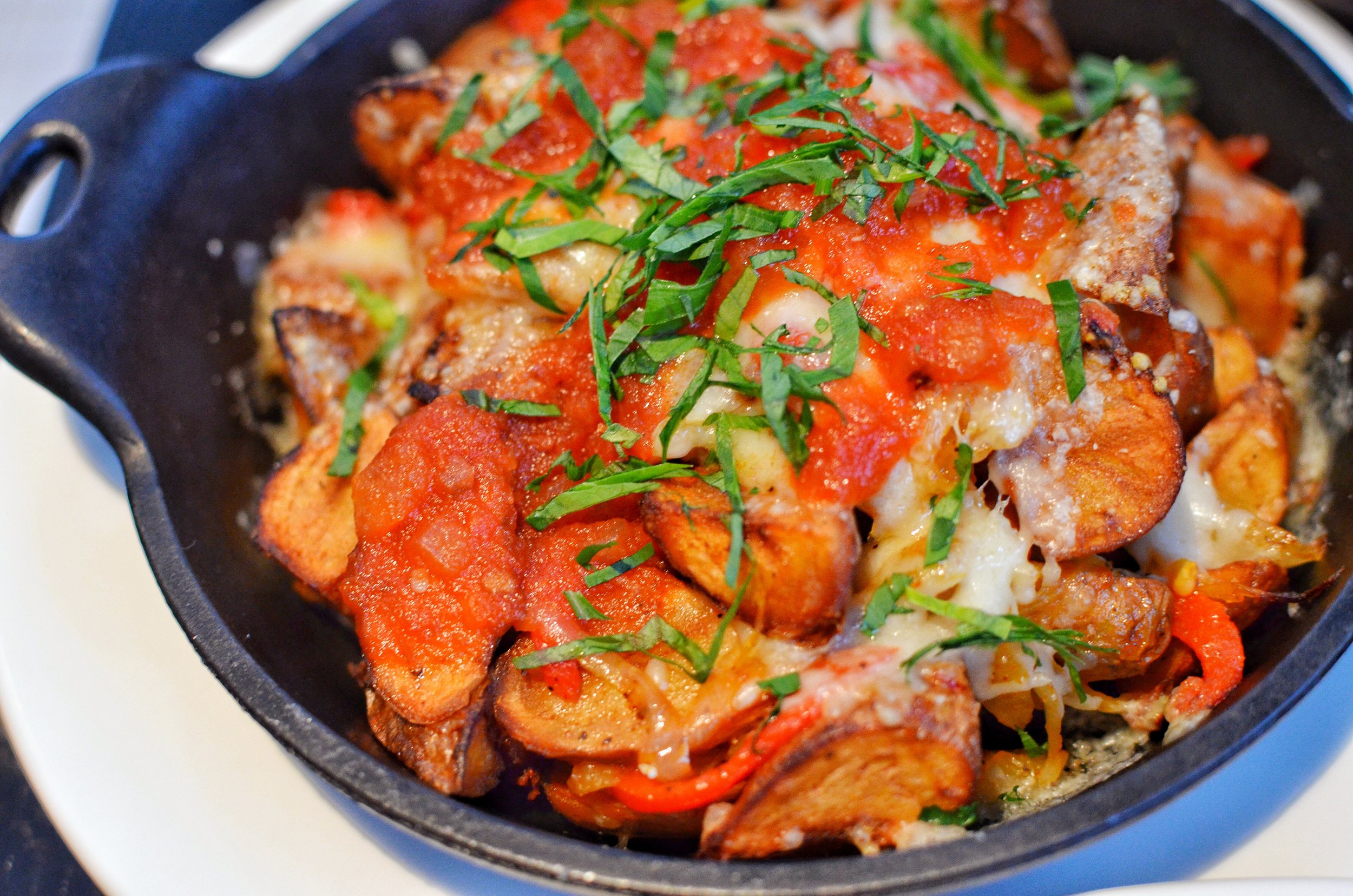 Potato hash with roasted bell peppers and cheese